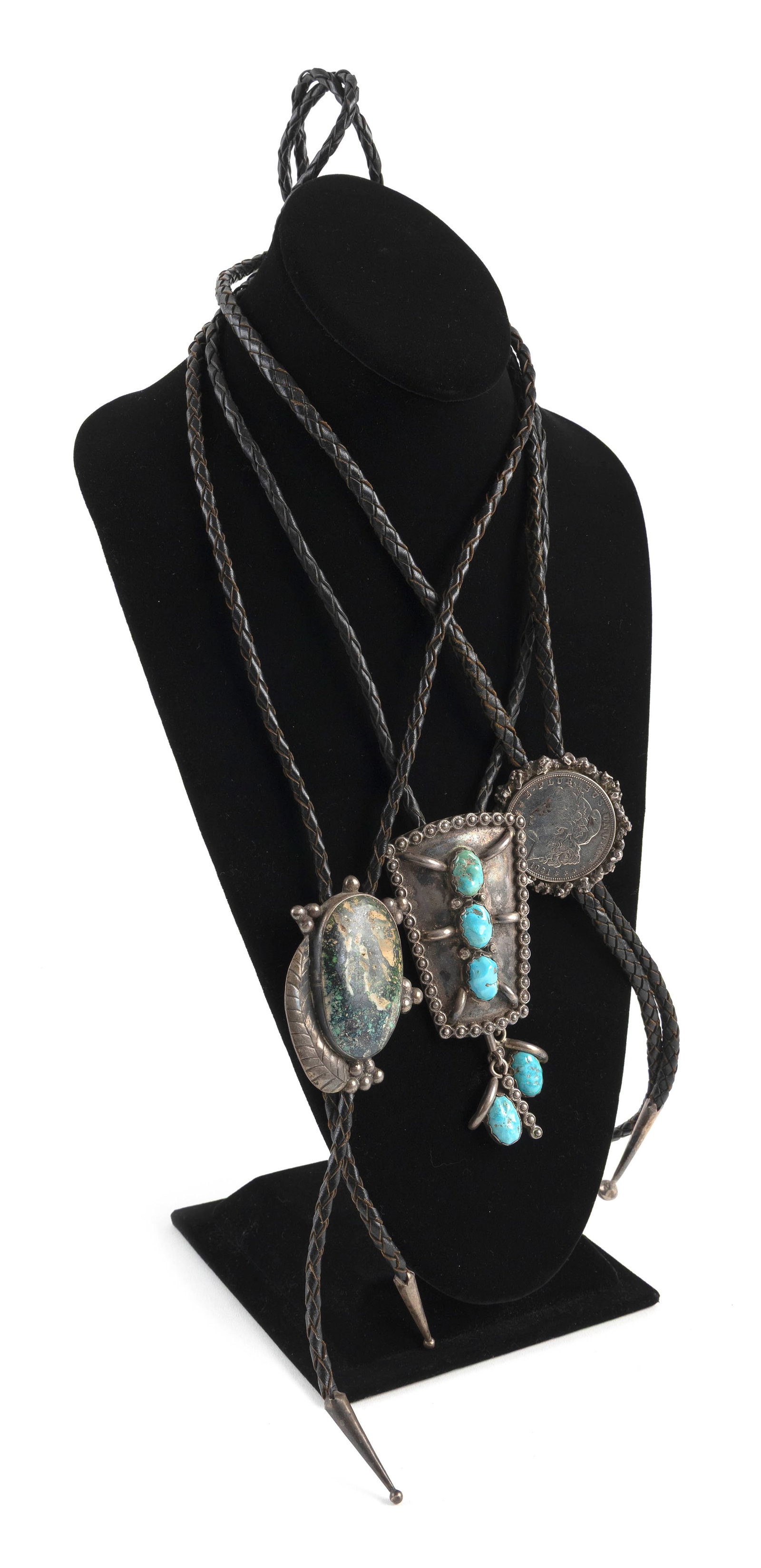 THREE SOUTHWESTERN BOLO TIES INCLUDING LEONARD MARTZA Mid-20th Century: THREE SOUTHWESTERN BOLO TIES INCLUDING LEONARD MARTZAMid-20th Century1) Leonard Martza Navajo silver trapezoidal clasp with three turquoise and three silver cones suspending turquoise drops. Clasp 2.7