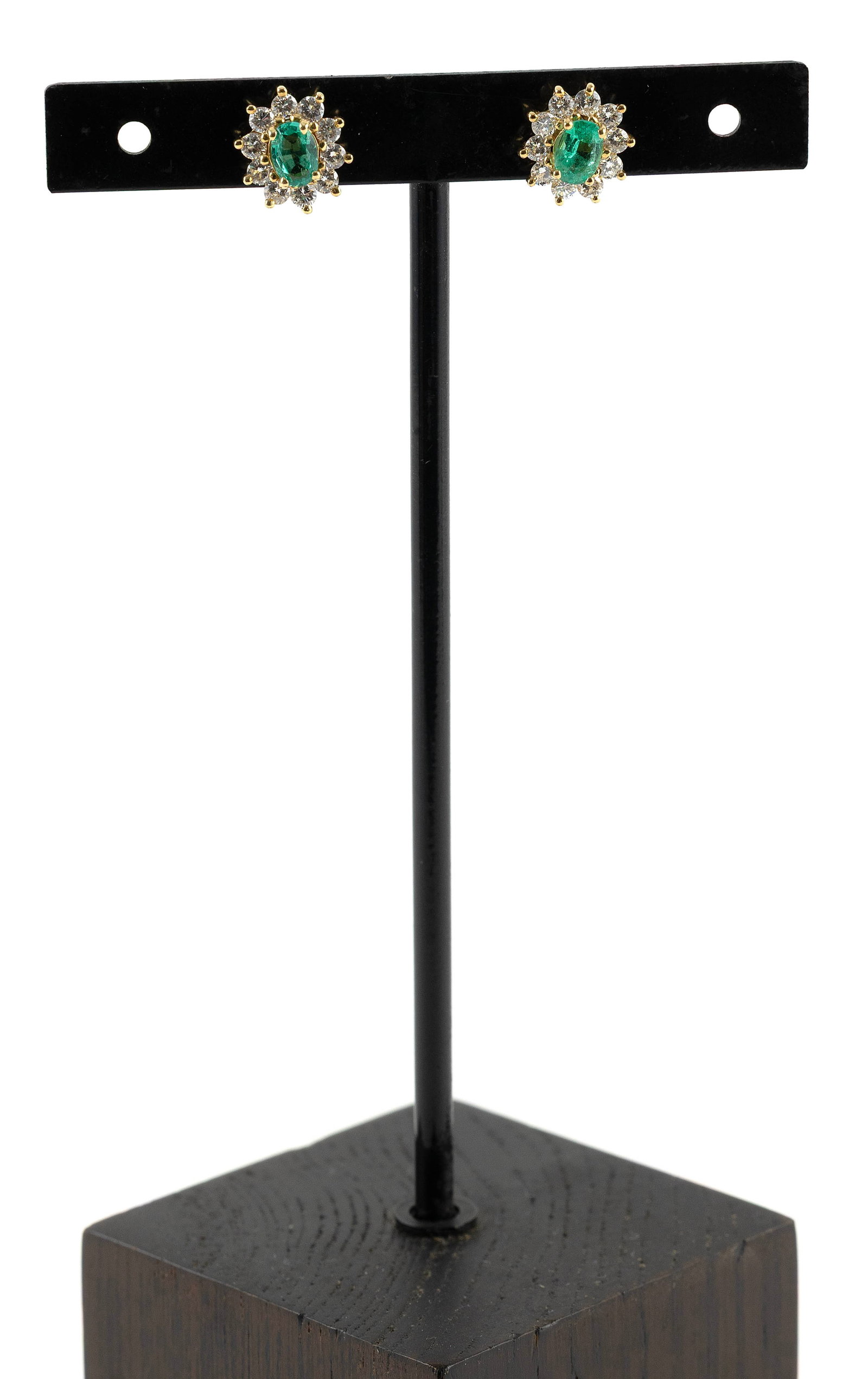 PAIR OF 14KT YELLOW GOLD, DIAMOND AND EMERALD EARRINGS Approx. 2.4 total dwt.: PAIR OF 14KT YELLOW GOLD, DIAMOND AND EMERALD EARRINGSEach with one approx. 4.0 x 6.0mm oval-cut emerald and ten small round-cut diamonds, approx. 0.50 ctw. Post backs with nuts. Stamped. Top approx.