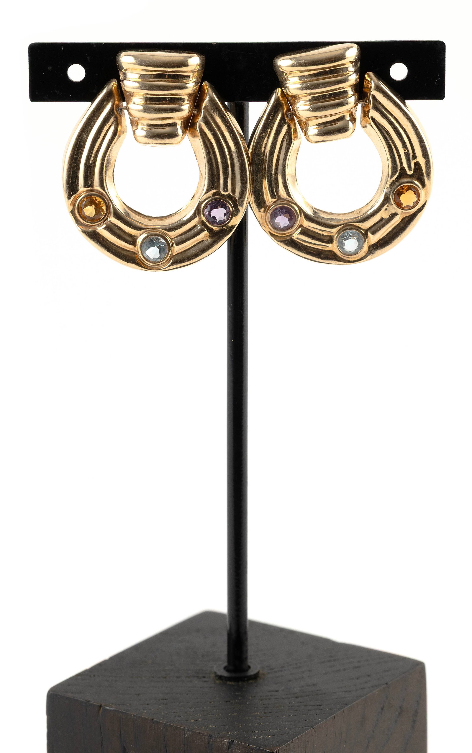 PAIR OF 14KT YELLOW GOLD, AMETHYST, CITRINE AND BLUE TOPAZ HOOP EARRINGS Approx. 6.4 total dwt.: PAIR OF 14KT YELLOW GOLD, AMETHYST, CITRINE AND BLUE TOPAZ HOOP EARRINGSEach with one approx. 4.0mm faceted round amethyst, citrine and blue topaz. Hinged post backs. Stamped and touchstone tested. Ap
