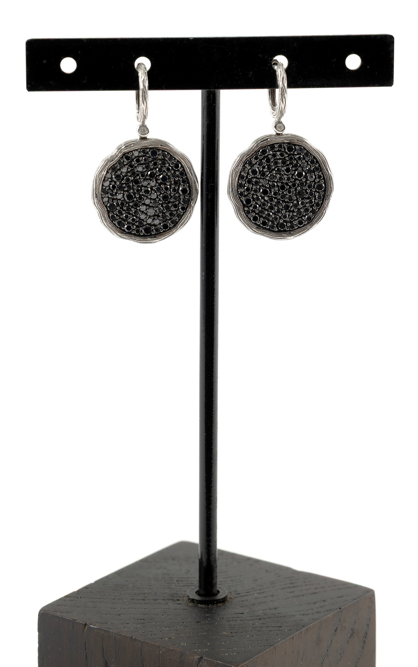 PAIR OF 14KT WHITE GOLD AND BLACK DIAMOND EARRINGS Approx. 4.7 total dwt.: PAIR OF 14KT WHITE GOLD AND BLACK DIAMOND EARRINGSBoth encrusted with small faceted black diamonds. Latch backs. Stamped. Diameter approx. 20.0mm.Approx. 4.7 total dwt.