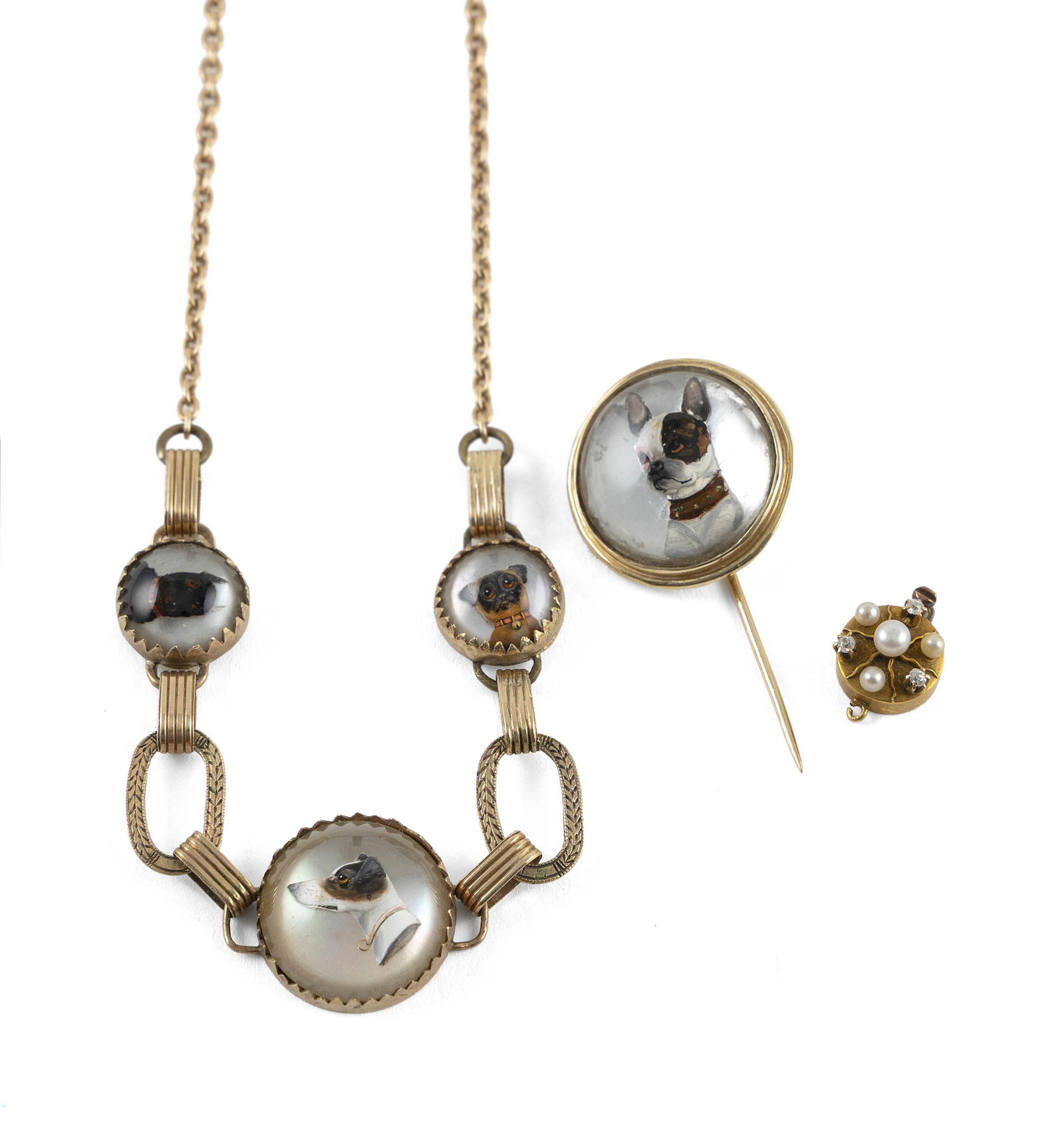 14KT YELLOW GOLD NECKLACE, PIN AND CLASP Approx. 16.6 total dwt.: 14KT YELLOW GOLD NECKLACE, PIN AND CLASP1) Necklace with three sulphide dog portraits. Spring ring clasp. Length 16".2) Pin with sulphide dog portrait. Diameter approx. 23.0mm.3) Round box clasp with