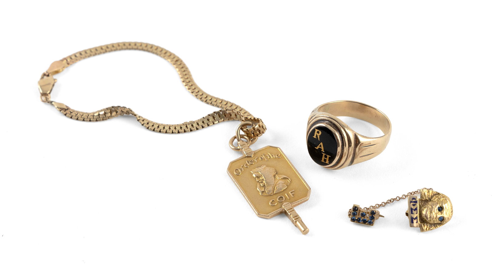 THREE PIECES OF 14KT YELLOW GOLD JEWELRY Approx. 12.3 total dwt.: THREE PIECES OF 14KT YELLOW GOLD JEWELRY1) Ring with an onyx inlaid with gold "RAH". Top approx. 10.0 x 12.0mm. Size 10.2) Flat link bracelet with one 14kt yellow gold Order of the Coif charm, approx.