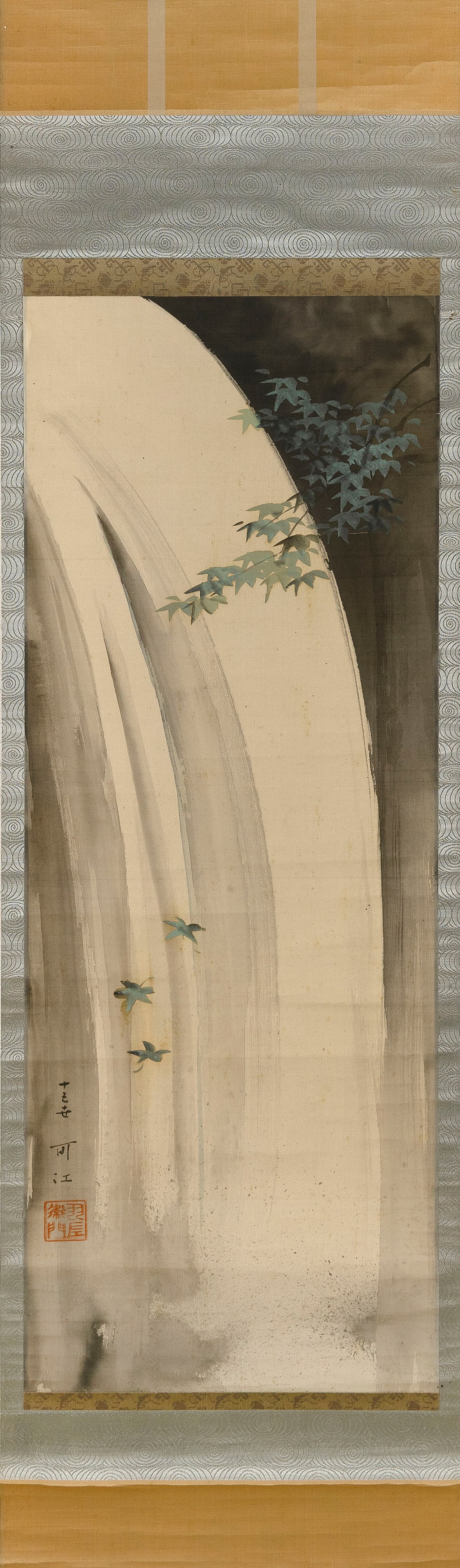 JAPANESE SCROLL PAINTING OF A WATERFALL: JAPANESE SCROLL PAINTING OF A WATERFALL 19th Century Foreground with a branch of green leaves accented with gilding. Signed and seal marked lower left. On silk, 36.75" x 13.75".