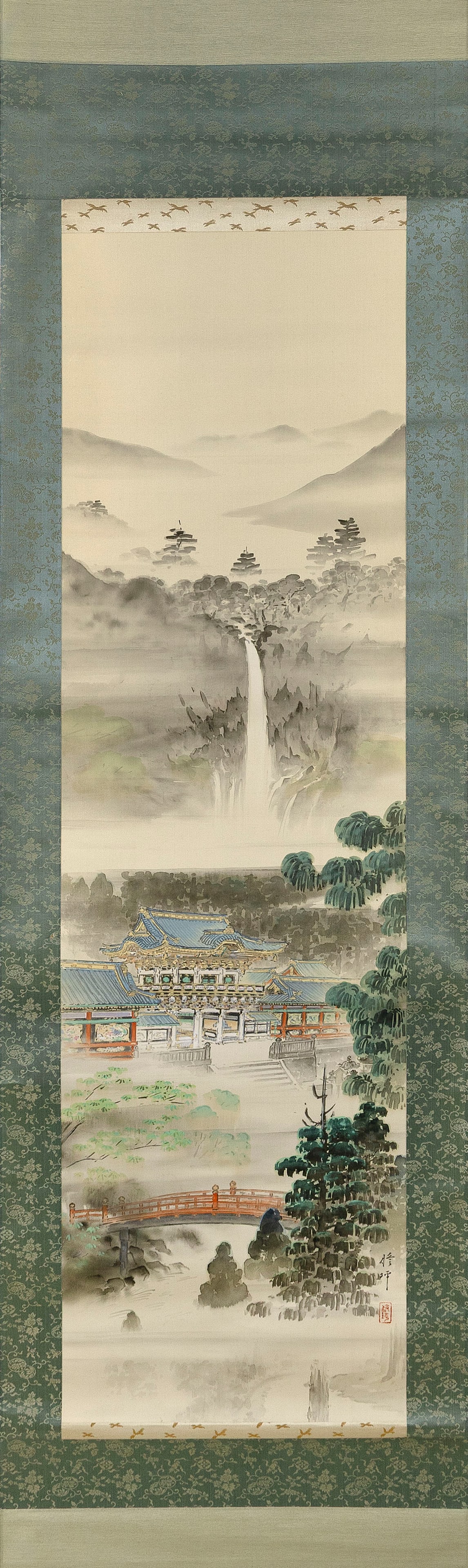 JAPANESE SCROLL PAINTING OF NIKKO: JAPANESE SCROLL PAINTING OF NIKKO 20th Century Landscape with a waterfall, Toshogu shrine and Shinkyo bridge. Signed and seal marked lower right. On silk, 48" x 14". With a kiriwood box marked "Nikko