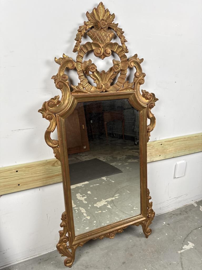 ROCOCO-STYLE CARVED AND GILT MIRROR Late 19th or 20th Century Height 39". Width 24". (1 of 6)