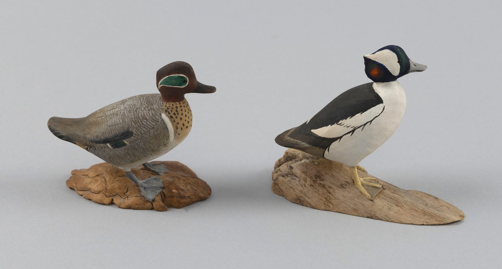 TWO HAROLD GIBBS MINIATURE DUCK CARVINGS Barrington, Rhode Island, 1866-1970 Heights 2.75" and 3". (1 of 5)
