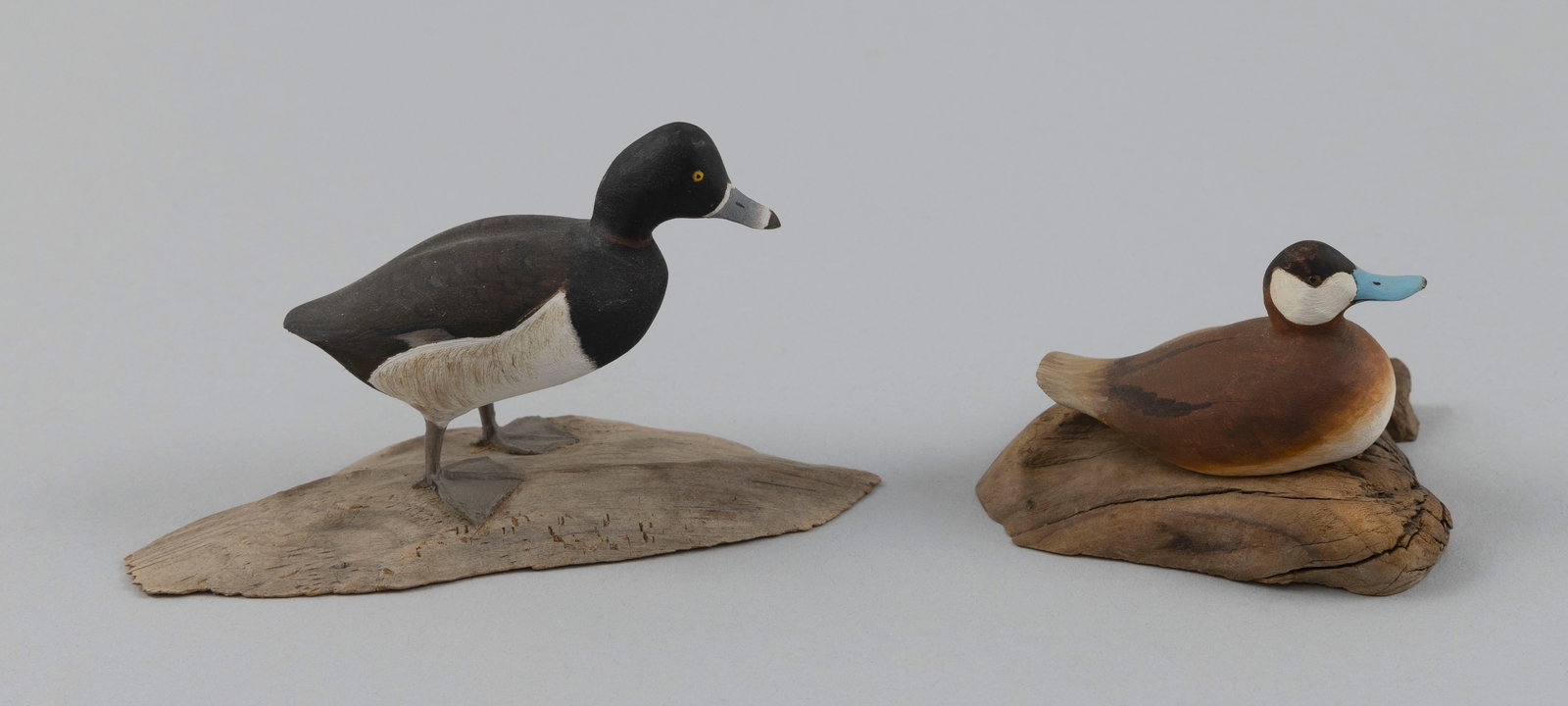TWO HAROLD GIBBS MINIATURE DUCK CARVINGS Barrington, Rhode Island, 1866-1970 Heights 2.5" and 1.75". (1 of 5)