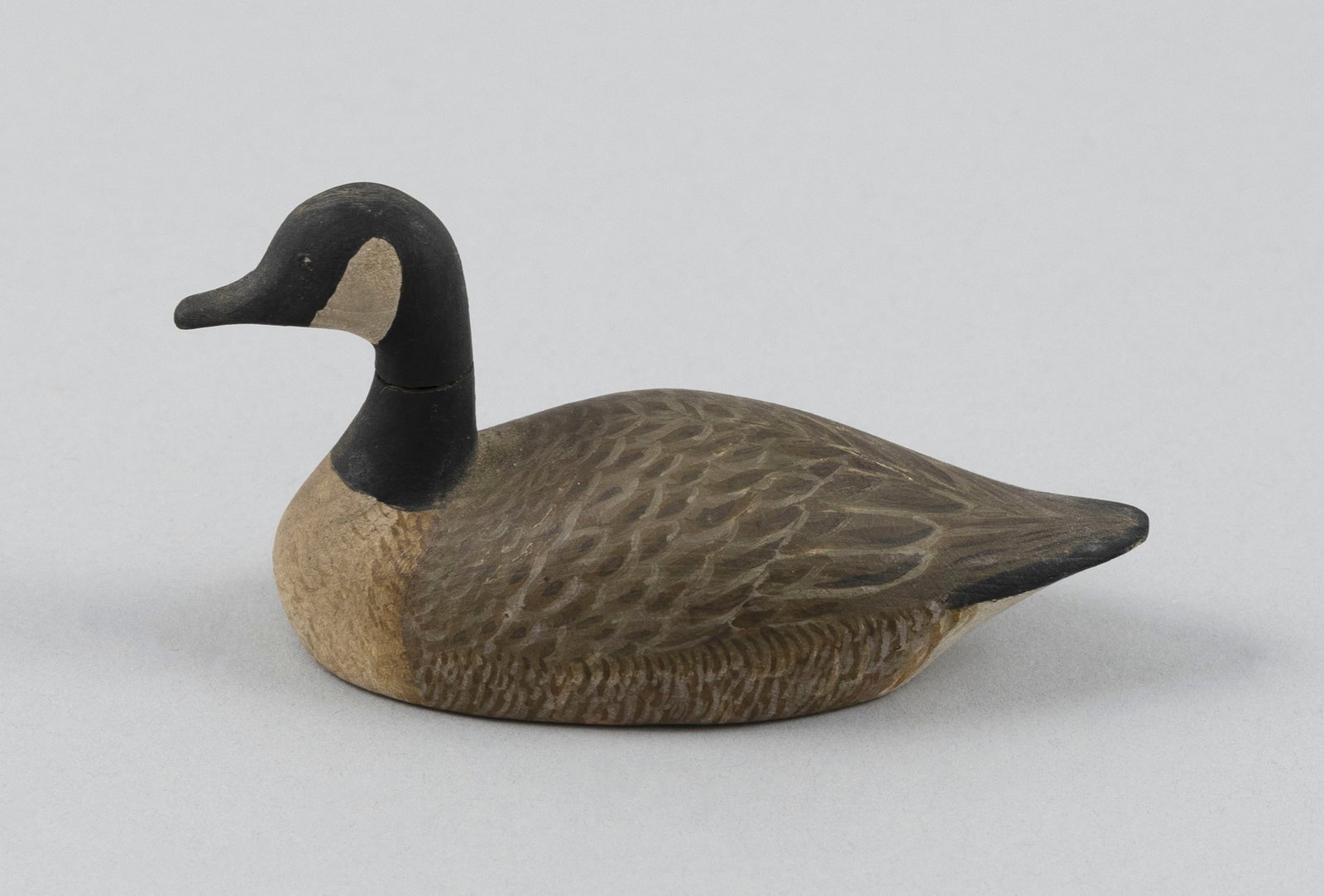 HAROLD GIBBS MINIATURE CANADA GOOSE CARVING Barrington, Rhode Island, 1866-1970 Length 3.5". (1 of 5)