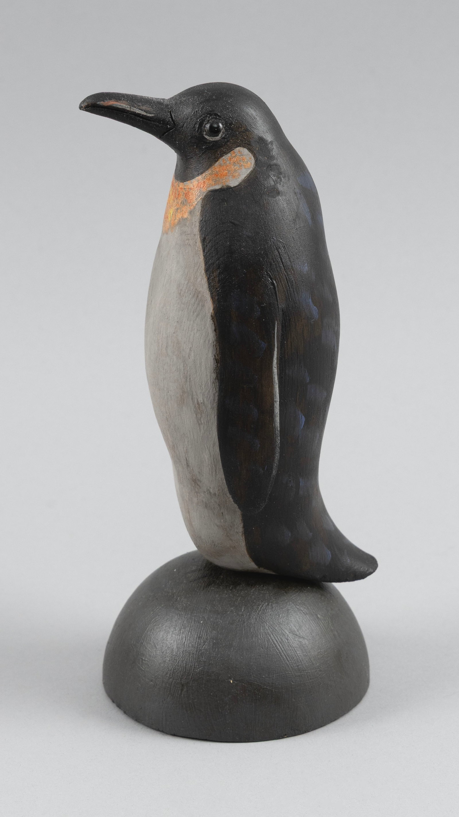 ROGER MITCHELL CARVED PENGUIN Massachusetts, Contemporary Height 7".: ROGER MITCHELL CARVED PENGUIN Massachusetts, Contemporary Standing on a domed base. Signed on underside. Height 7". Notes: Roger C. Mitchell is an avid hunter, fisherman and well-known New England car