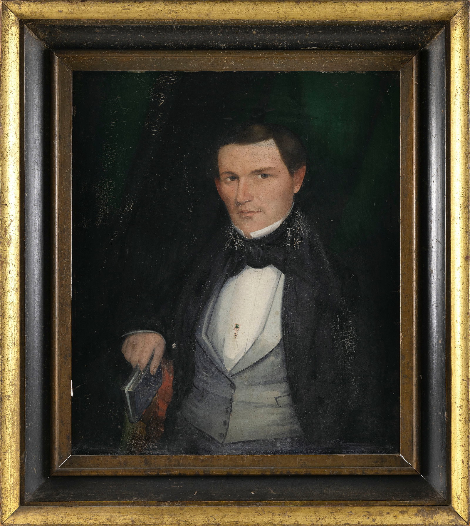 AMERICAN SCHOOL (19th Century,), Portrait of a gentleman holding a book., Oil on board, 28.5" x 34". (1 of 2)