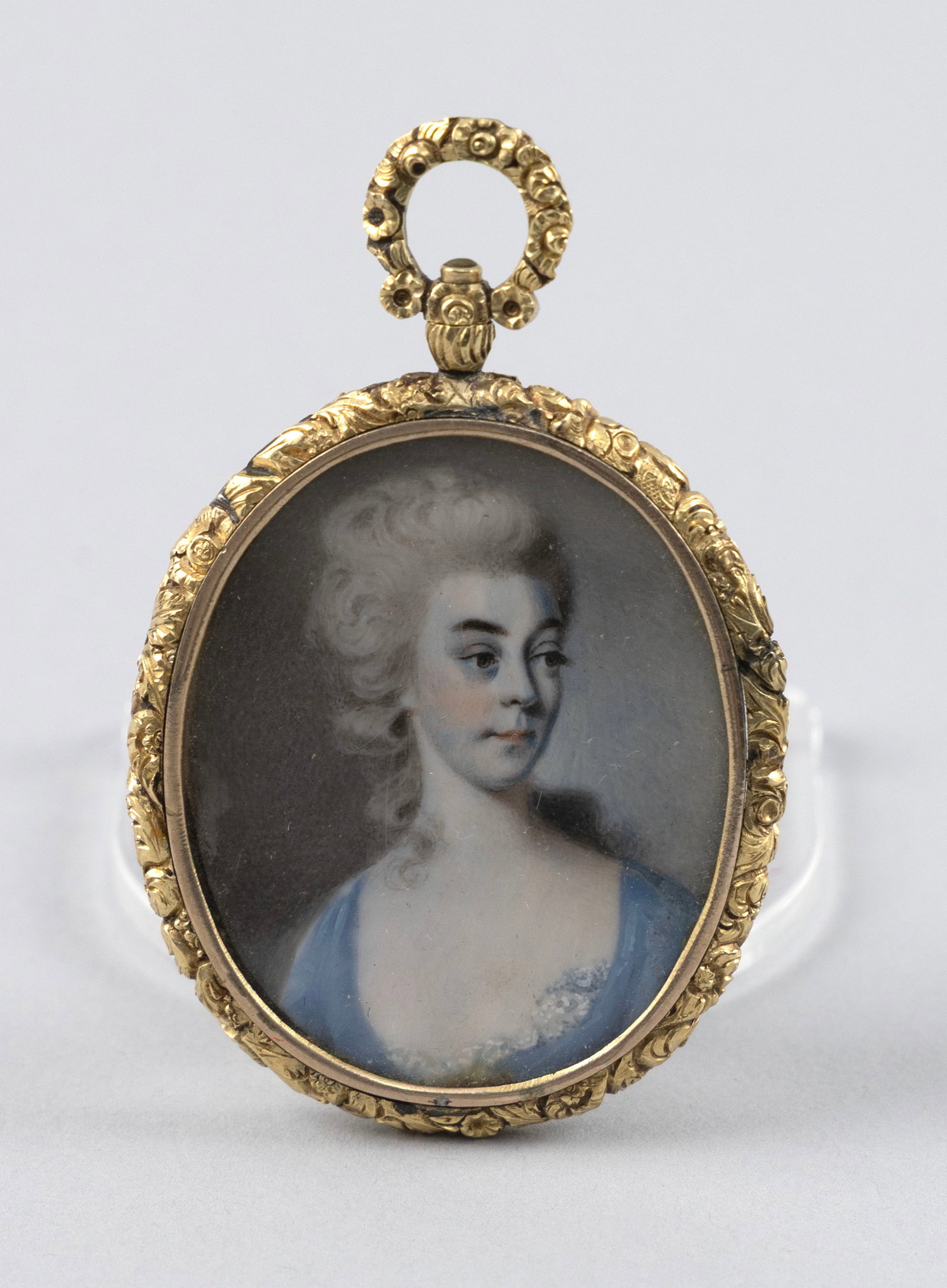 PORTRAIT MINIATURE ON IVORY OF A WOMAN 19th Century Framed 1.75" x 1.5".: PORTRAIT MINIATURE ON IVORY OF A WOMAN 19th Century Framed with a lock of braided hair. Framed 1.75" x 1.5". Provenance: The Estate of Paul and Diane Madden, Sandwich, Massachusetts.