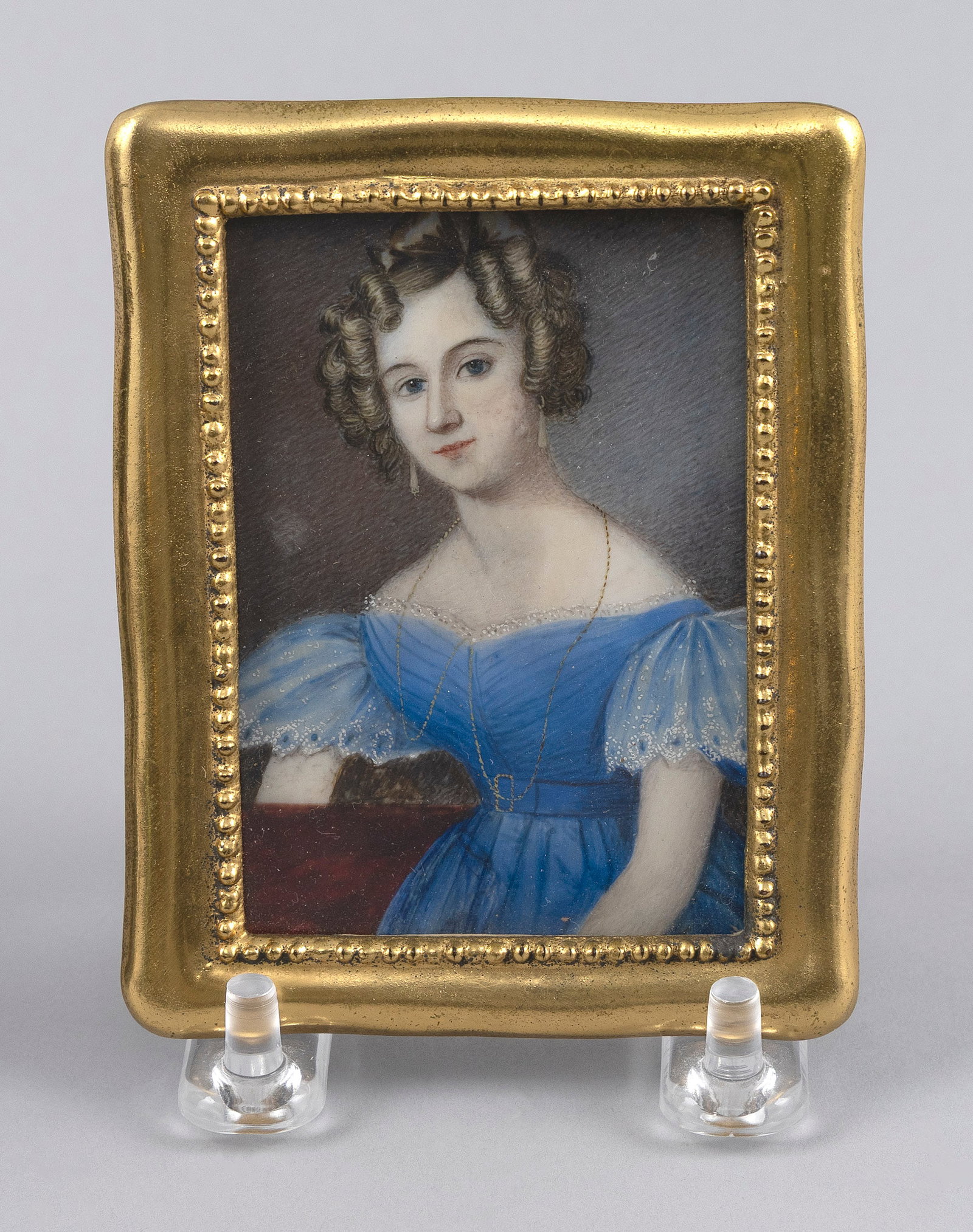 PORTRAIT MINIATURE OF A YOUNG WOMAN WEARING A BLUE DRESS 19th Century 3" x 2" sight. Framed 3.75" x (1 of 2)