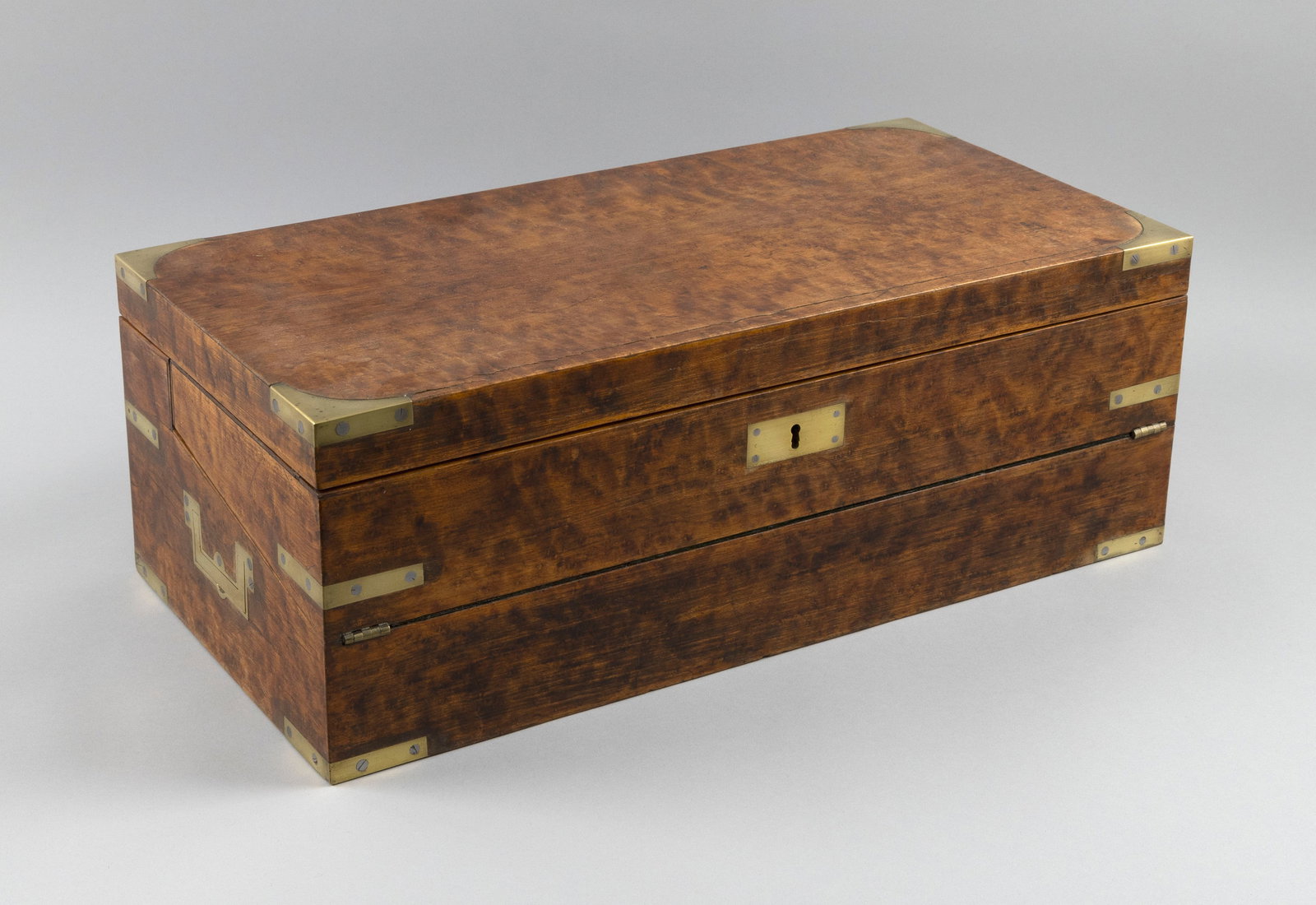 BRASS-BOUND FIGURED MAPLE LAP DESK 19th Century Height 7.25". Width 20". Depth 10".: BRASS-BOUND FIGURED MAPLE LAP DESK 19th Century Nicely fitted interior. Recessed brass carrying handles at sides. Height 7.25". Width 20". Depth 10".