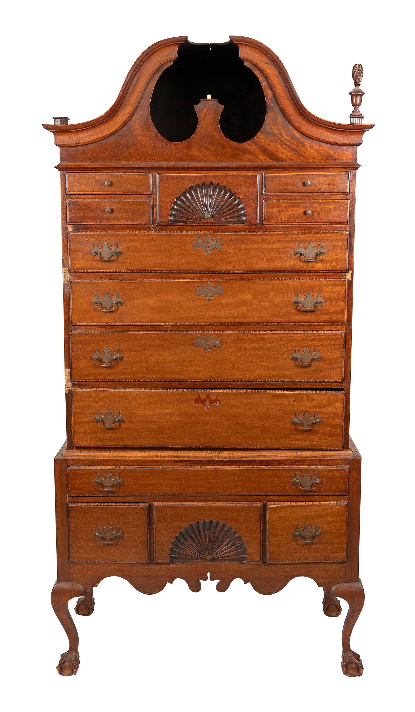 BONNET-TOP HIGHBOY Late 19th Century Height 81". Width 38". Depth 20".: BONNET-TOP HIGHBOY Late 19th Century In two parts, made of tiger maple and other woods. Upper case with urn-form finials, four small drawers centering a fan-carved drawer, and four graduated full-widt