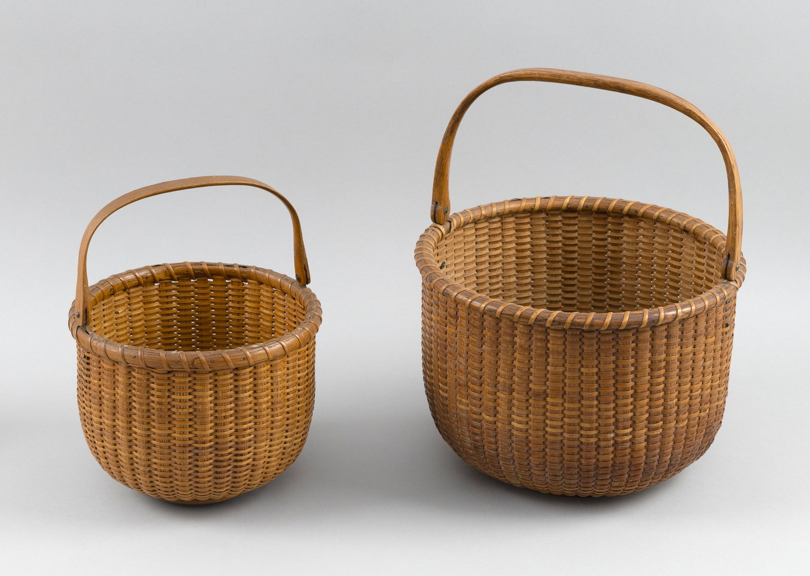 TWO NANTUCKET BASKETS Early 20th Century Heights 5.5" and 6.5". (1 of 5)