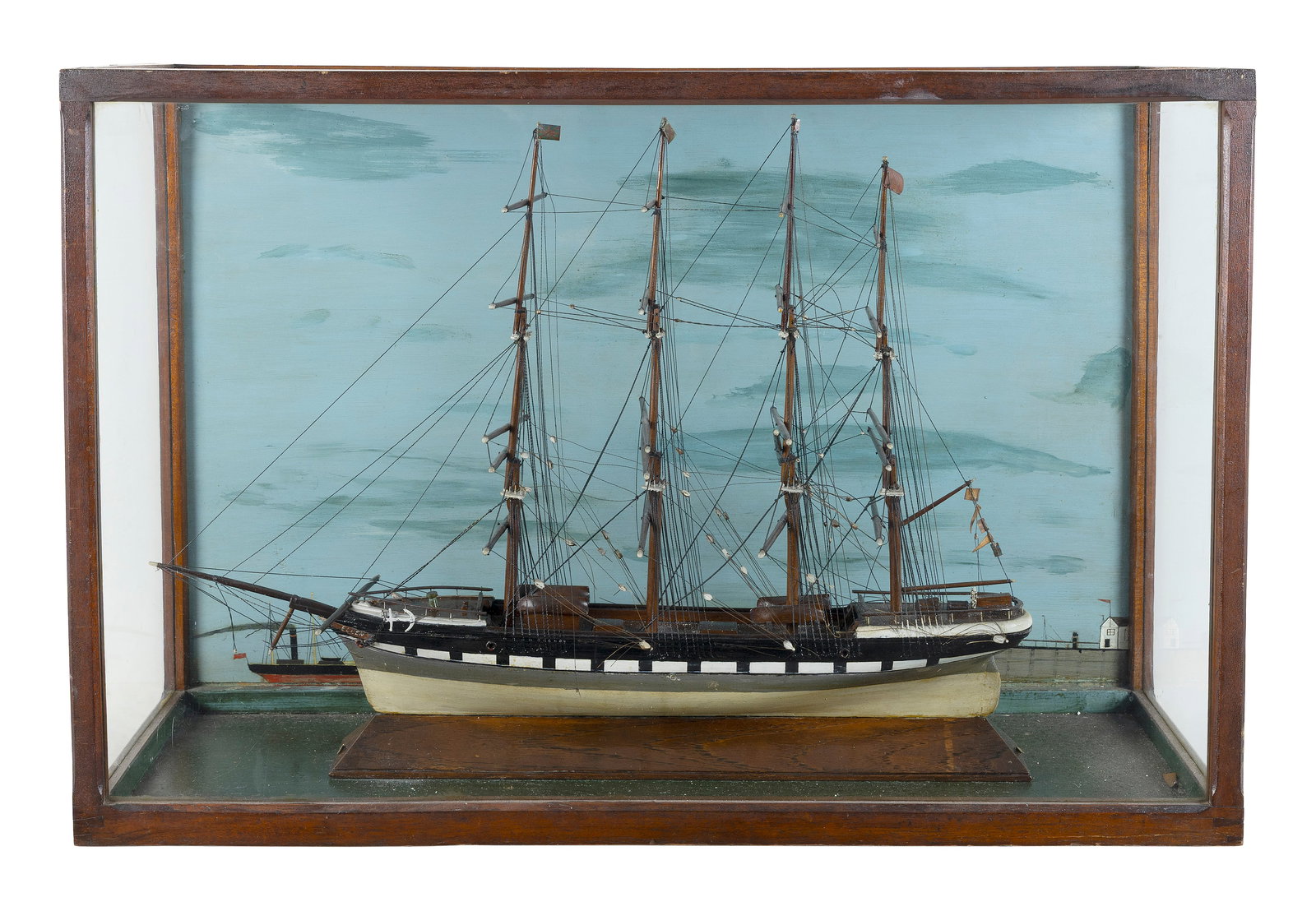 CASED MODEL OF A FOUR-MASTED VESSEL Early 20th Century Case height 22". Length 33.25". Width 12.25". (1 of 1)