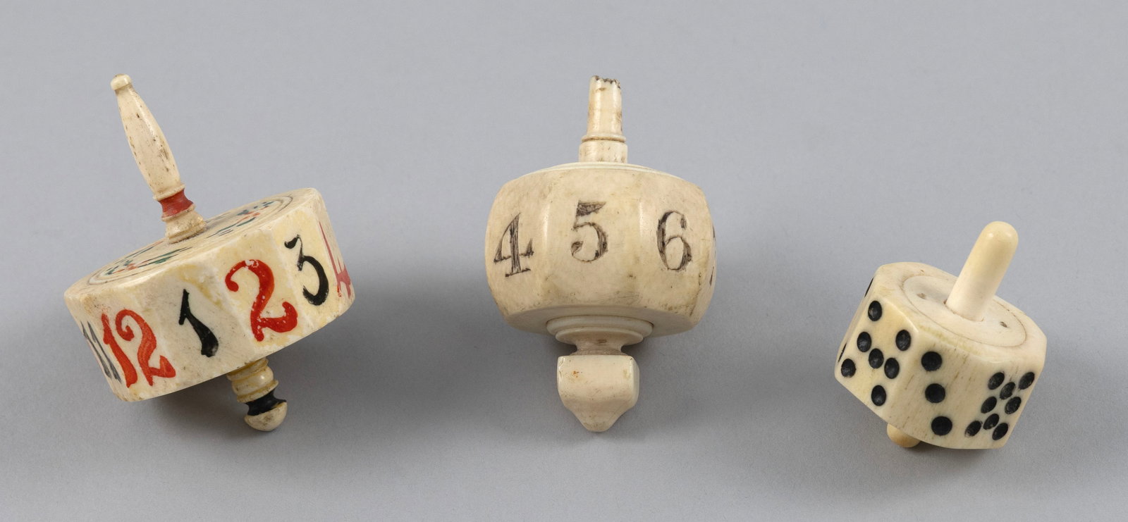THREE IVORY SPINNING GAME TOPS 19th Century Lengths from 4.75" to 2.5". (1 of 4)