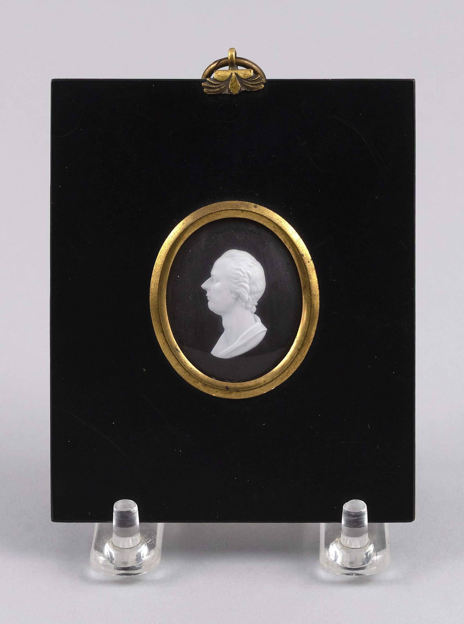 ATTRIBUTED TO JAMES TASSIE (United Kingdom, Late 18th/Early 19th Century), White paste profile (1 of 2)
