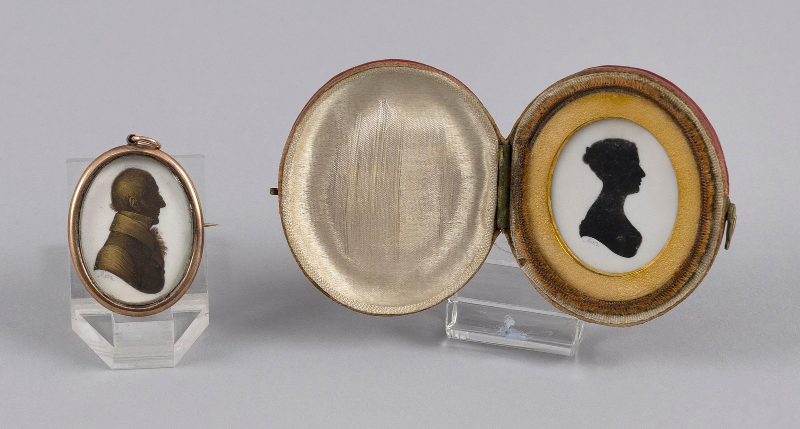 JOHN MIERS (Mid-19th Century,), Two silhouette portrait miniatures: Y Y JOHN MIERS Mid-19th Century Two silhouette portrait miniatures, both signed "Miers" for John Miers of Miers & Field: 1) Gilded gentleman. Set within a gold-tone brooch. Overall 1.25" x 1". 2) Engl