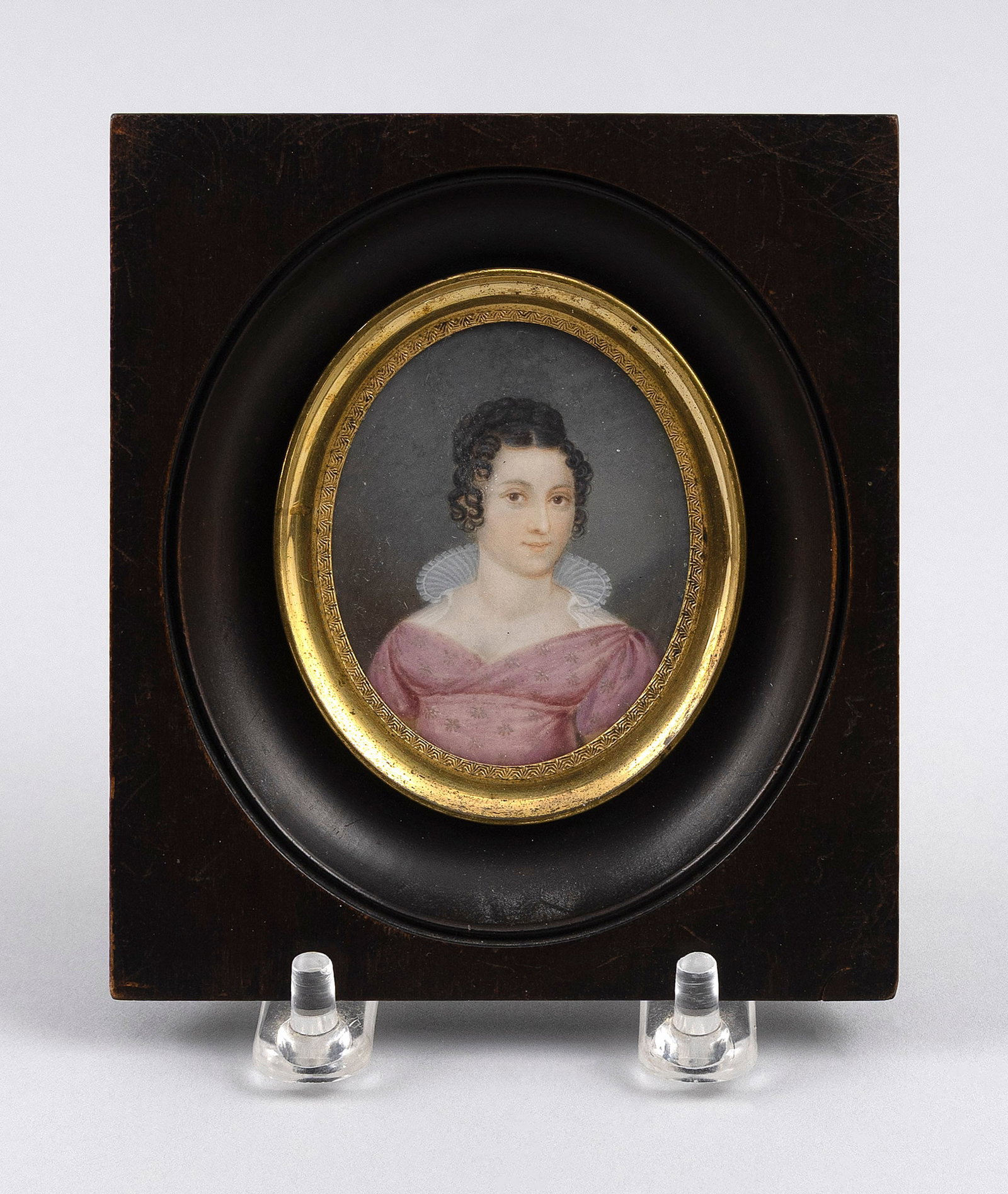 JOSEPH BERNHARD EINSLE (Germany, 1794-1829), Portrait miniature on ivory of a young woman, Framed: Y Y JOSEPH BERNHARD EINSLE Germany, 1794-1829 Portrait miniature on ivory of a young woman wearing a pink dress with ruffled collar. Signed and dated right margin "Einsle, Pinx. 30-June 1819". Framed 