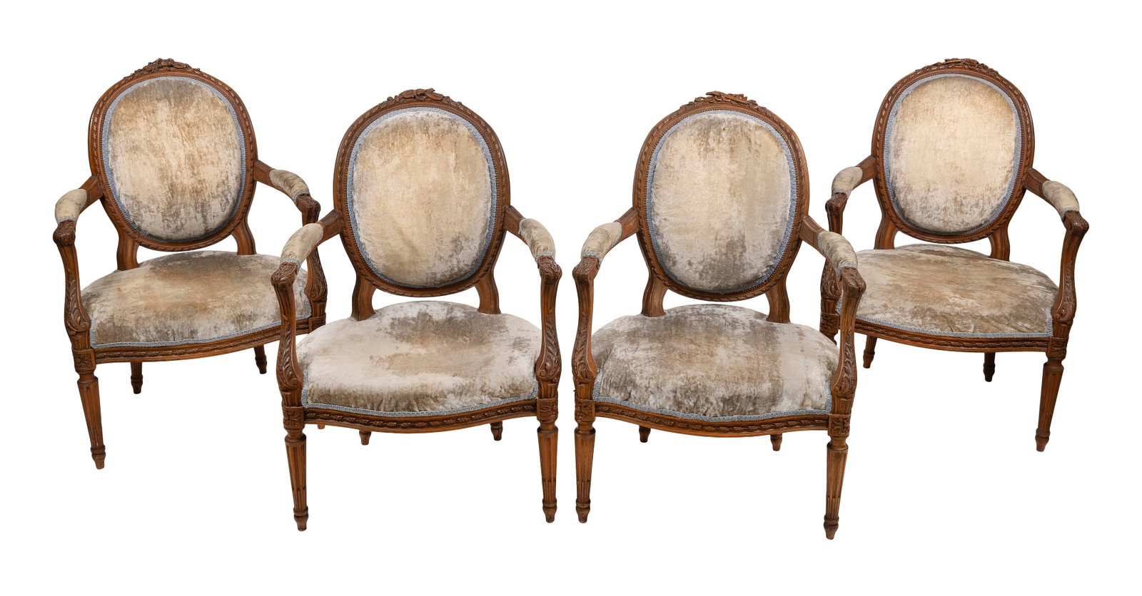 SET OF FOUR LOUIS XVI FAUTEUILS France, 19th Century Back heights 36". Seat heights 16".: SET OF FOUR LOUIS XVI FAUTEUILS France, 19th Century Fruitwood frames. Ribbon-carved backs with musical instrument and other decorative carvings at crest. Arm supports with acanthus leaf carvings. Flu