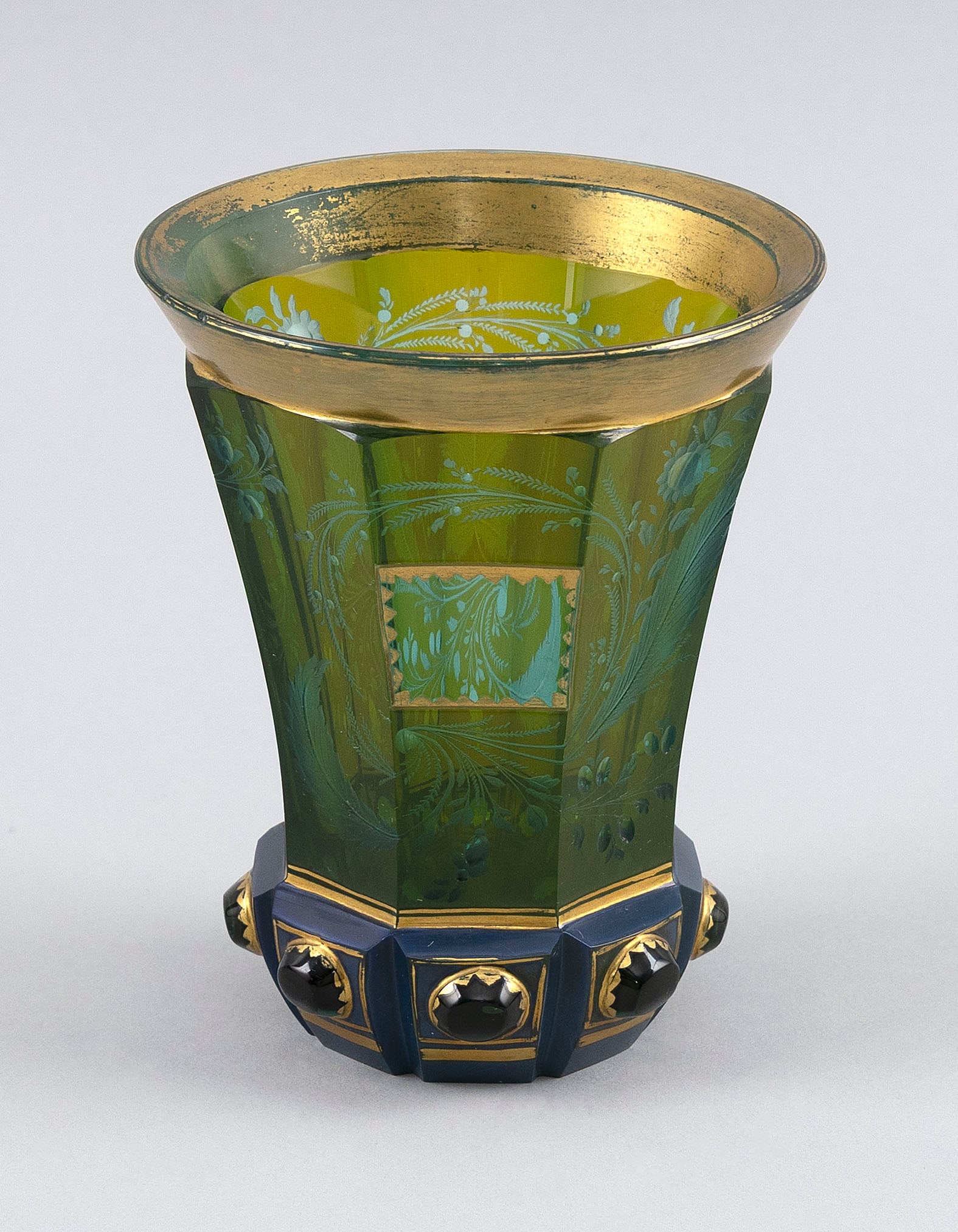 RARE BIEDERMEIER BOHEMIAN GLASS BEAKER Mid 19th Century Height 4.5".: RARE BIEDERMEIER BOHEMIAN GLASS BEAKER Mid 19th Century Pale green hexagonal body with detailed floral engraving. Blue lithyalin-type foot. Gilt trim. Height 4.5". Provenance: The Estate of Harold Sma
