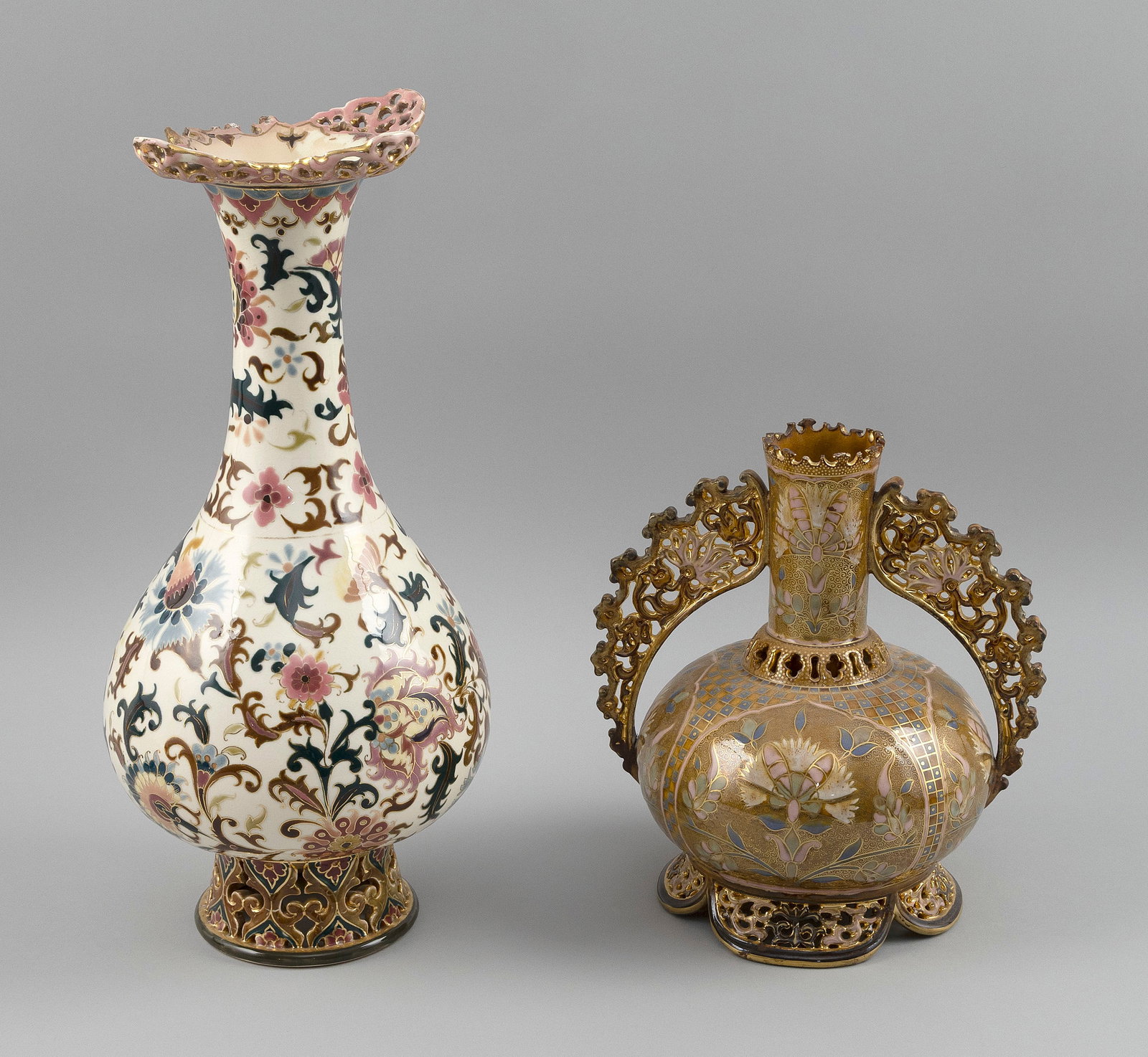TWO ZSOLNAY PORCELAIN VASES Hungary, Late 19th Century Heights 10" and 15.5". (1 of 4)