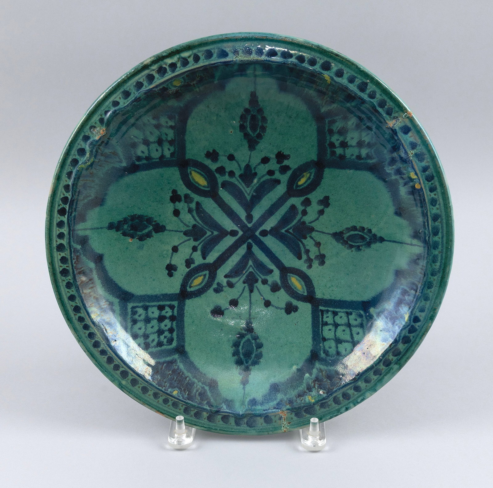 MOROCCAN POTTERY SHALLOW FOOTED BOWL Safi, 19th Century Diameter 12".: MOROCCAN POTTERY SHALLOW FOOTED BOWL Safi, 19th Century Dark blue lobed floral and scroll decoration against a turquoise ground. Signed on base. Diameter 12".