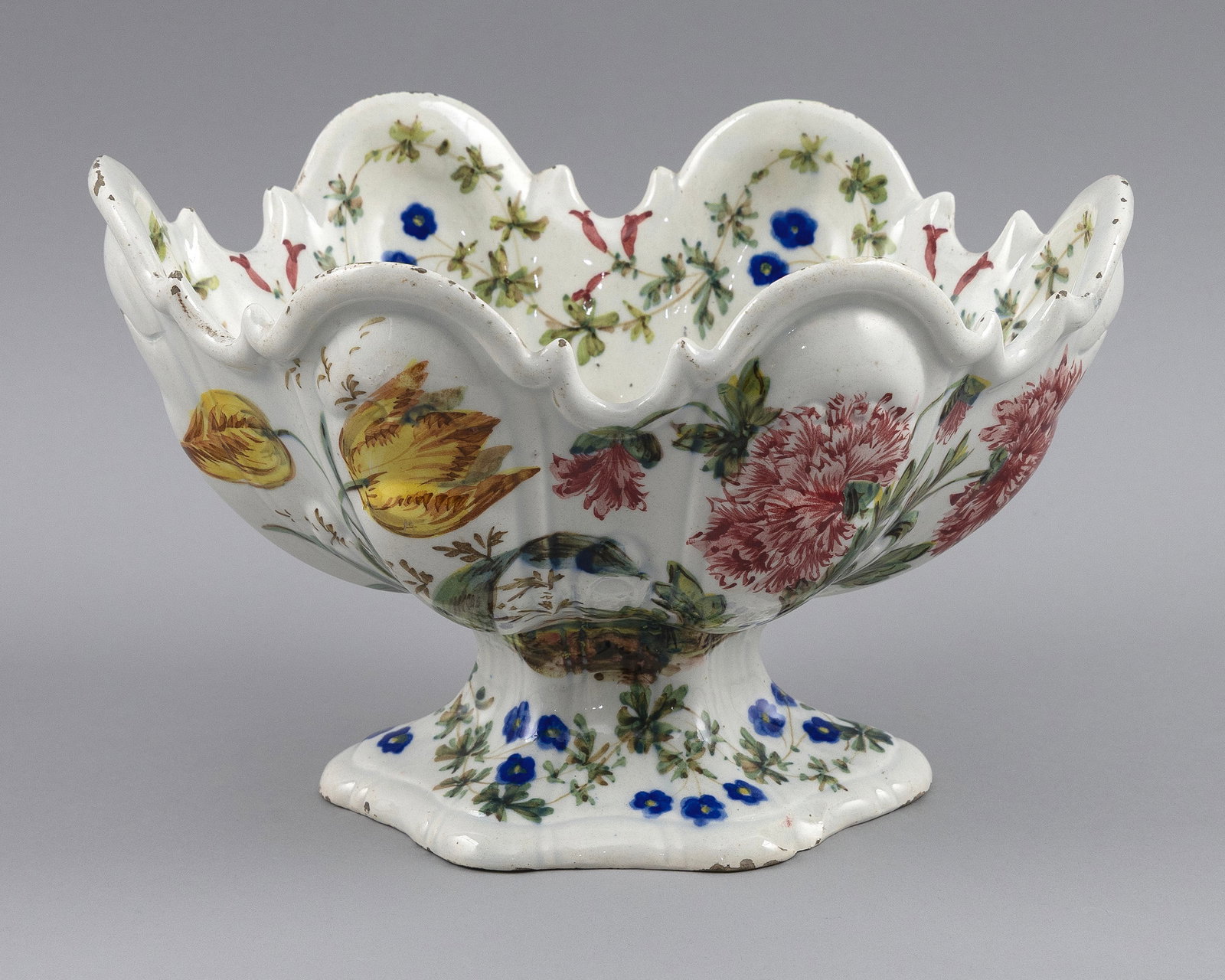 ITALIAN FAIENCE MONTEITH 20th Century Height 6.25". Length 10". Width 7.5".: ITALIAN FAIENCE MONTEITH 20th Century Decoration of tulips and carnations. Height 6.25". Length 10". Width 7.5".