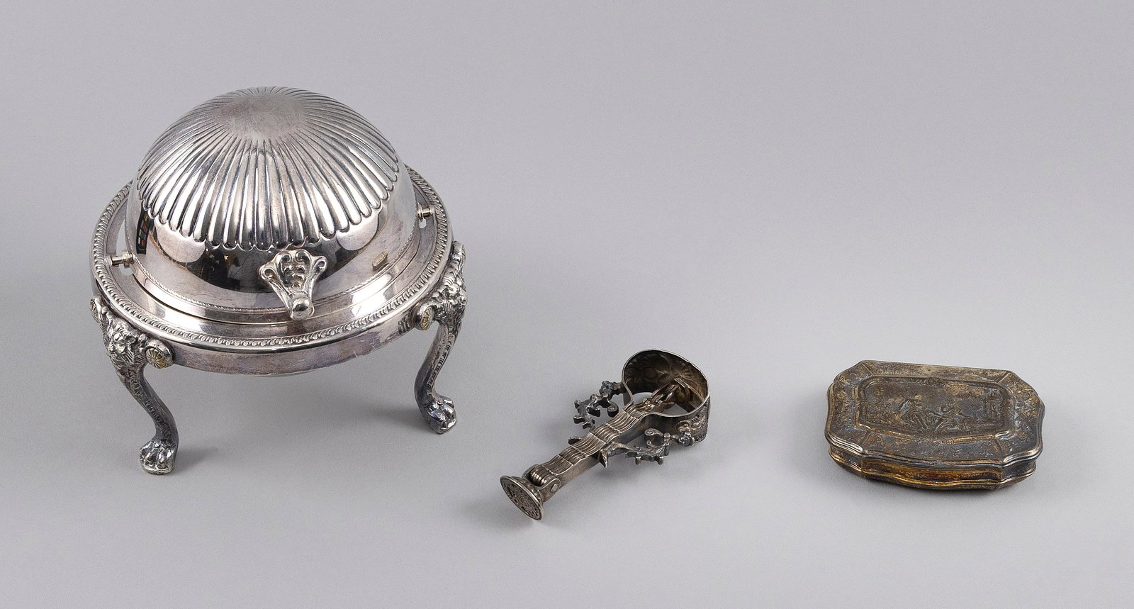 THREE SILVER ITEMS: THREE SILVER ITEMS 1) Continental silver snuff box. 3" x 2.25". 2) Wax seal with four fold-out attachments. Unmarked. Length 3.25". 3) Rogers silver plated butter dish with retractable lid. Height 4.7