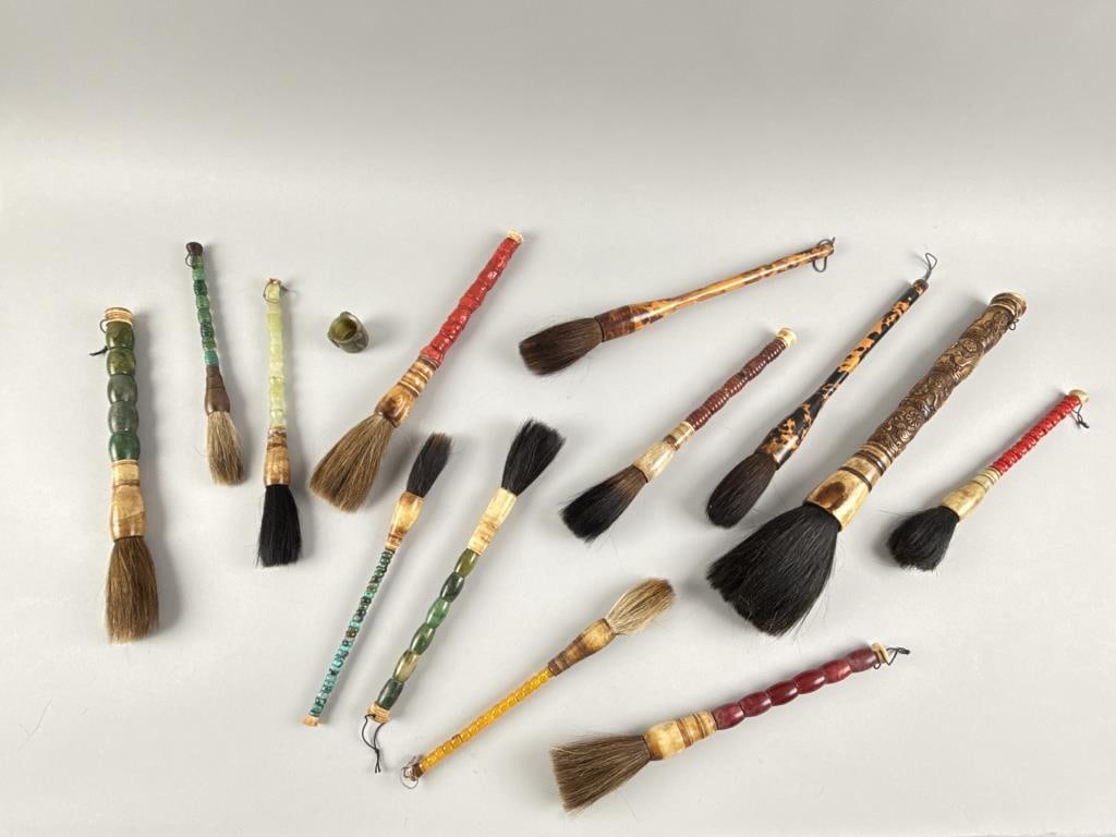 COLLECTION OF SCHOLARS' BRUSHES AND A HARDSTONE ARCHER'S RING 20th Century Brush lengths from 10.5": COLLECTION OF SCHOLARS' BRUSHES AND A HARDSTONE ARCHER'S RING 20th Century Approx. 13 brushes. Brush lengths from 10.5" to 17.5". Ring length 1.25".