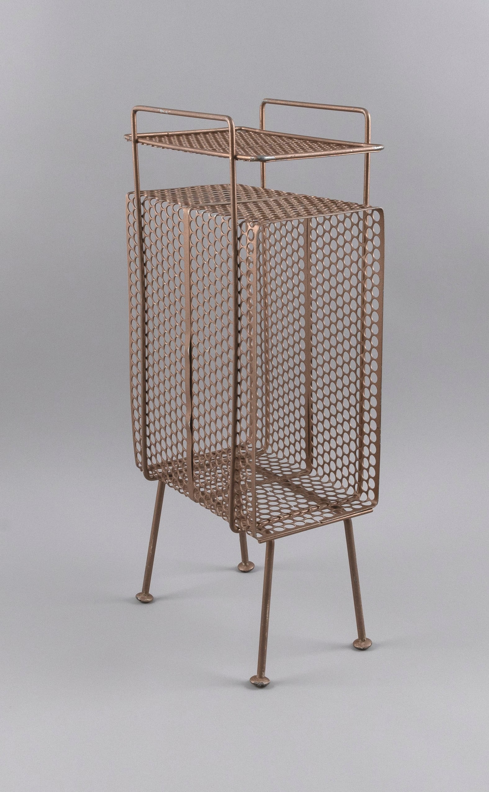 GOLD-TONE WIRE MESH TELEPHONE STAND/MAGAZINE RACK IN THE STYLE OF RICHARD GALEF Mid-20th Century: GOLD-TONE WIRE MESH TELEPHONE STAND/MAGAZINE RACK IN THE STYLE OF RICHARD GALEF Mid-20th Century With tray top and slightly splayed legs. Height 22". Width 10". Depth 6".