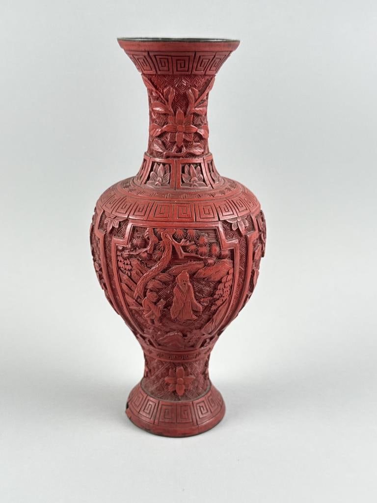 CHINESE RED CINNABAR BALUSTER VASE Late 19th Century Height 10".: CHINESE RED CINNABAR BALUSTER VASE Late 19th Century Carved with alternating figural and floral panels. Height 10".