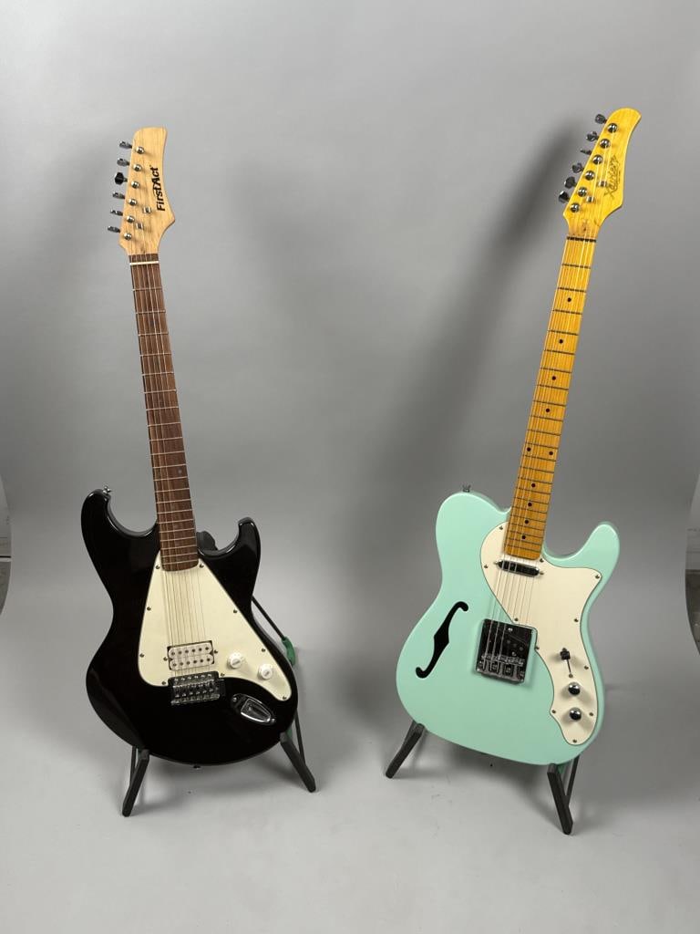 TWO GUITARS Contemporary Lengths 39" and 39.5".: TWO GUITARS Contemporary Xaviere Custom and a First Act. Aqua blue and black finishes. Lengths 39" and 39.5".