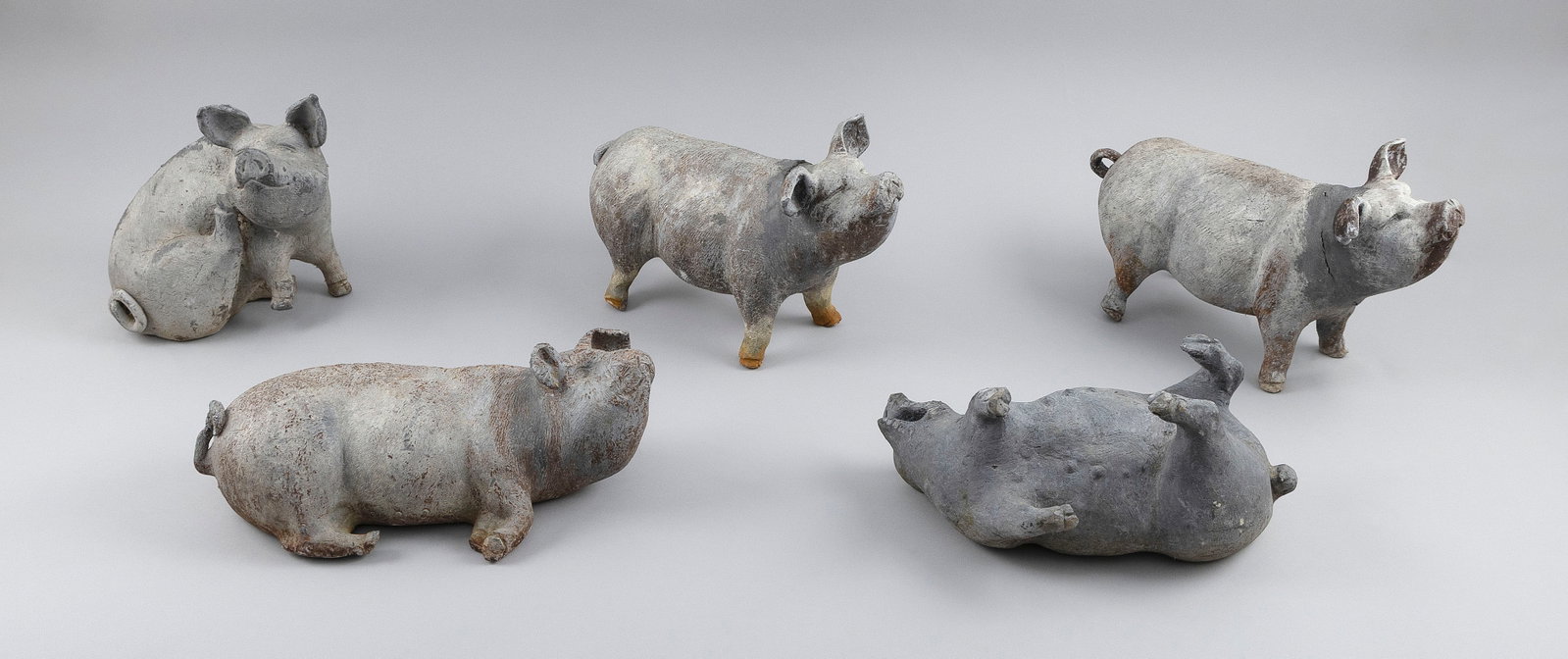 FIVE CAST LEAD GARDEN PIGS 20th Century Lengths from 9" to 13". (1 of 2)