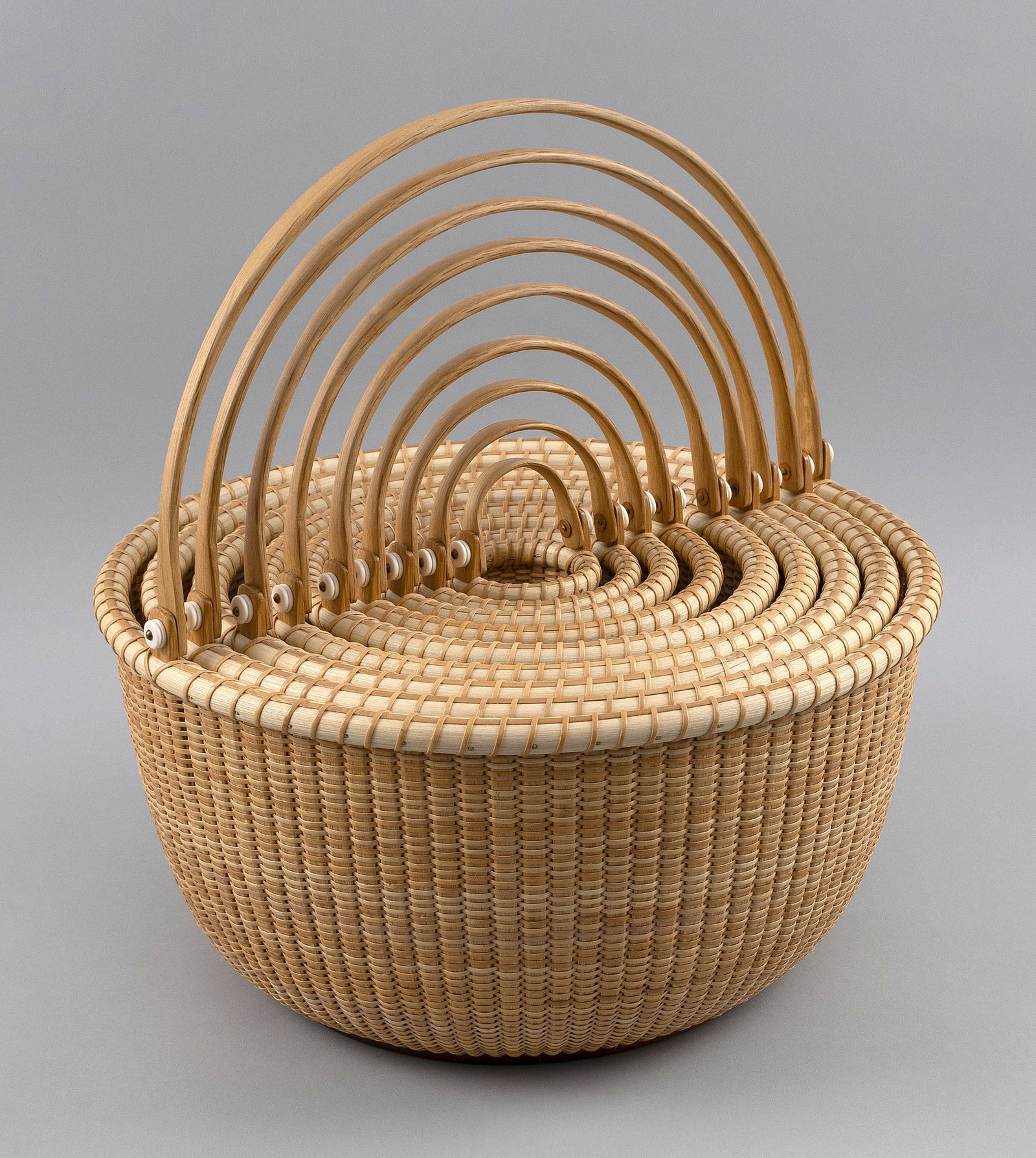 NEST OF NINE BILL AND JUDY SAYLE NANTUCKET BASKETS Dated 2019 Heights to 7". Diameters to 14". (1 of 7)