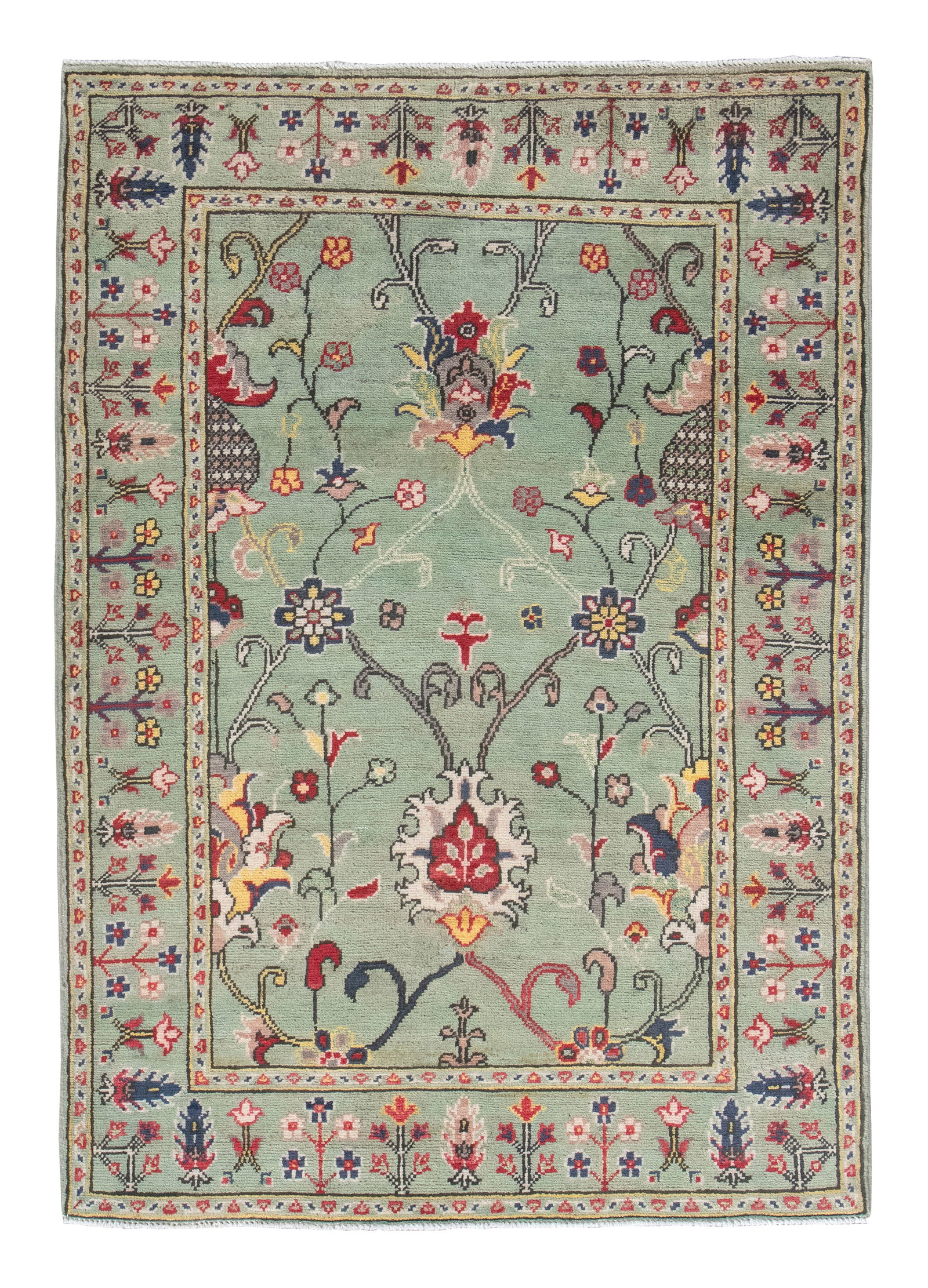 PERSIAN DESIGN RUG: 3'6" X 4'10" 21st Century: PERSIAN DESIGN RUG: 3'6" X 4'10" 21st Century Green field and borders contain ivory, green, red and blue meandering vines bearing colorful blossoms and palmettes. Stylized flowering branch repeats thr