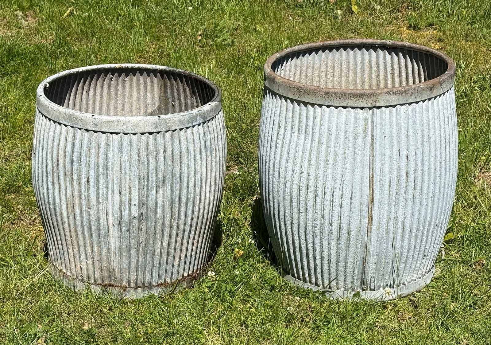 TWO ZINC GARDEN BARRELS 20th Century Heights 18.5" and 22.5". (1 of 2)