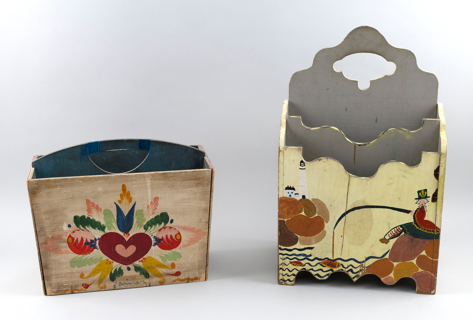 PETER HUNT (Massachusetts, 1896-1967), Two wooden magazine holders, Heights 12.5" and 23".: PETER HUNT Massachusetts, 1896-1967 Two wooden magazine holders, one with painted decoration of hearts and roses and the other with figures and a verse. Heights 12.5" and 23".