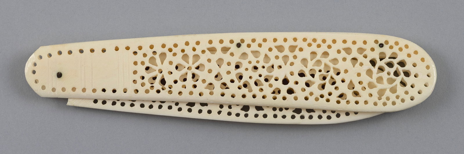 CARVED AND PIERCED BONE FOLDING LETTER OPENER Late 19th Century Length open 9.5". (1 of 3)