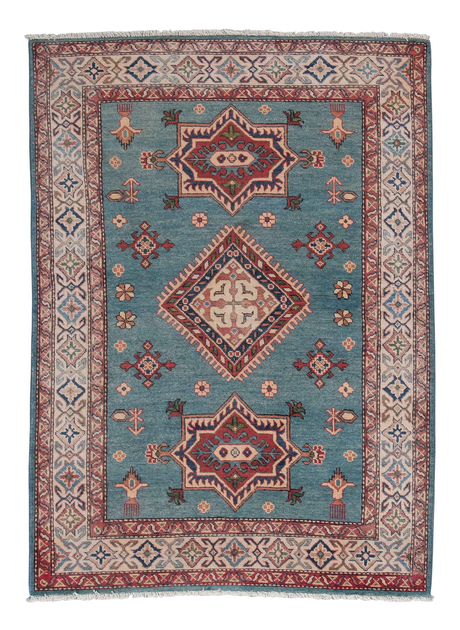 KAZAK DESIGN RUG: 4'2" X 5'9" 21st Century: KAZAK DESIGN RUG: 4'2" X 5'9" 21st Century Light blue field with traditional geometric medallions and stylized motifs in ivory, dark blue, light blue and rust red. Abrashed red and bright ivory