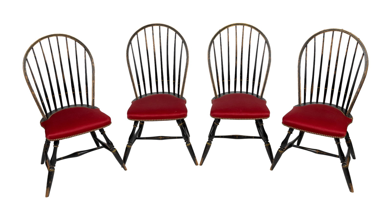 SET OF FOUR PAINT-DECORATED WINDSOR SIDE CHAIRS America, Circa 1800 Back heights 36.75". Seat: SET OF FOUR PAINT-DECORATED WINDSOR SIDE CHAIRS America, Circa 1800 Chrome yellow banding and highlights against an ebonized ground. Red seat upholstery with brass tack banding. Turned legs joined by 