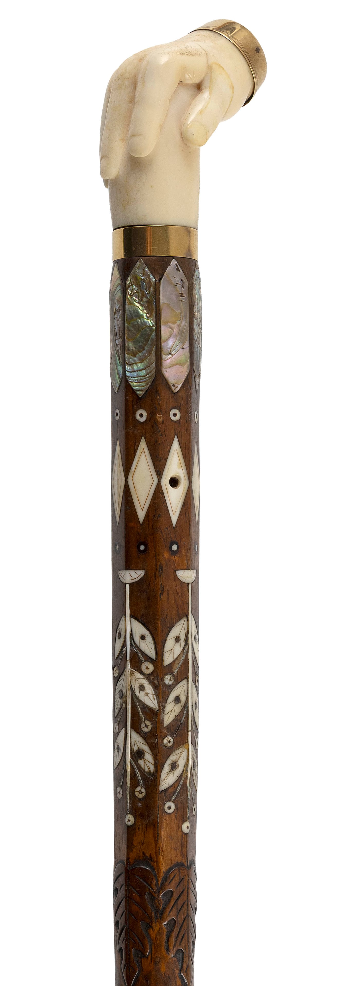 OUTSTANDING CARVED AND INLAID MARINE IVORY, ABALONE AND MAHOGANY WALKING STICK America, 19th Century: OUTSTANDING CARVED AND INLAID MARINE IVORY, ABALONE AND MAHOGANY WALKING STICK America, 19th Century Walrus ivory handle carved as a right hand grasping a shaft, with an abalone disk inlaid at the top