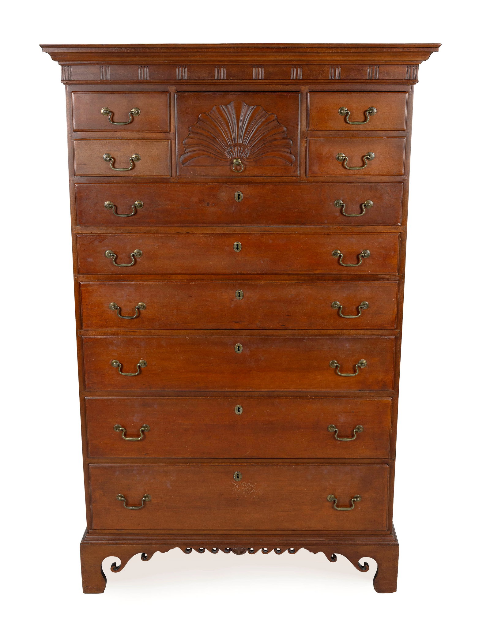 IMPORTANT CHIPPENDALE CHERRY TALL CHEST New London or Norwich, Connecticut, Circa 1775 Height: IMPORTANT CHIPPENDALE CHERRY TALL CHEST New London or Norwich, Connecticut, Circa 1775 Deeply molded cornice flares over a frieze carved in a matchstick design. Case with a fan-carved central drawer f