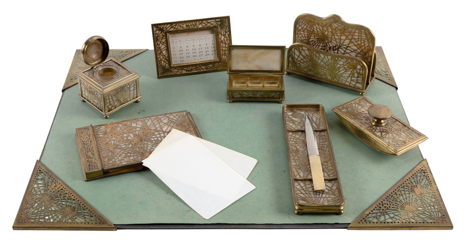 TIFFANY STUDIOS "PINE NEEDLE" EIGHT-PIECE DESK SET New York, Circa 1910-1920 Heights to 5.25".: TIFFANY STUDIOS "PINE NEEDLE" EIGHT-PIECE DESK SET New York, Circa 1910-1920 Bronze over caramel slag glass. Each piece numbered and marked "Tiffany Studios New York" unless otherwise noted. Comprised