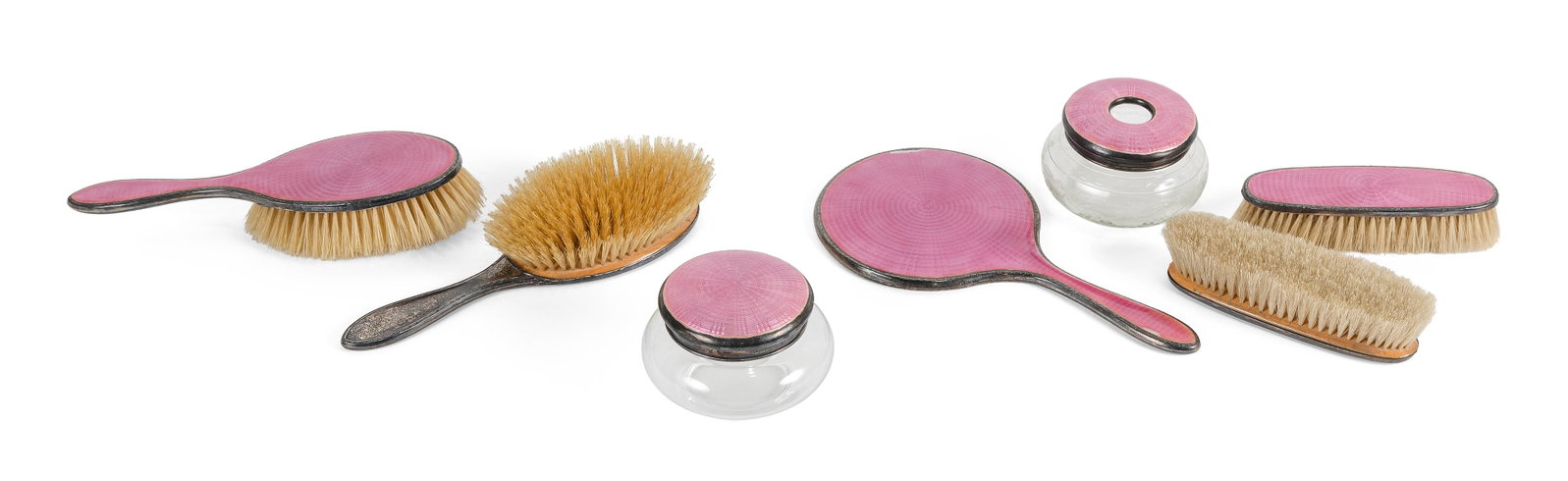 ENGLISH SILVER AND RASPBERRY PINK GUILLOCHE ENAMEL SEVEN-PIECE VANITY SET Late 19th/Early 20th: ENGLISH SILVER AND RASPBERRY PINK GUILLOCHE ENAMEL SEVEN-PIECE VANITY SET Late 19th/Early 20th Century Enamel with a radiating sunburst pattern. Glass with etched floral swag decoration. Hallmarked. C