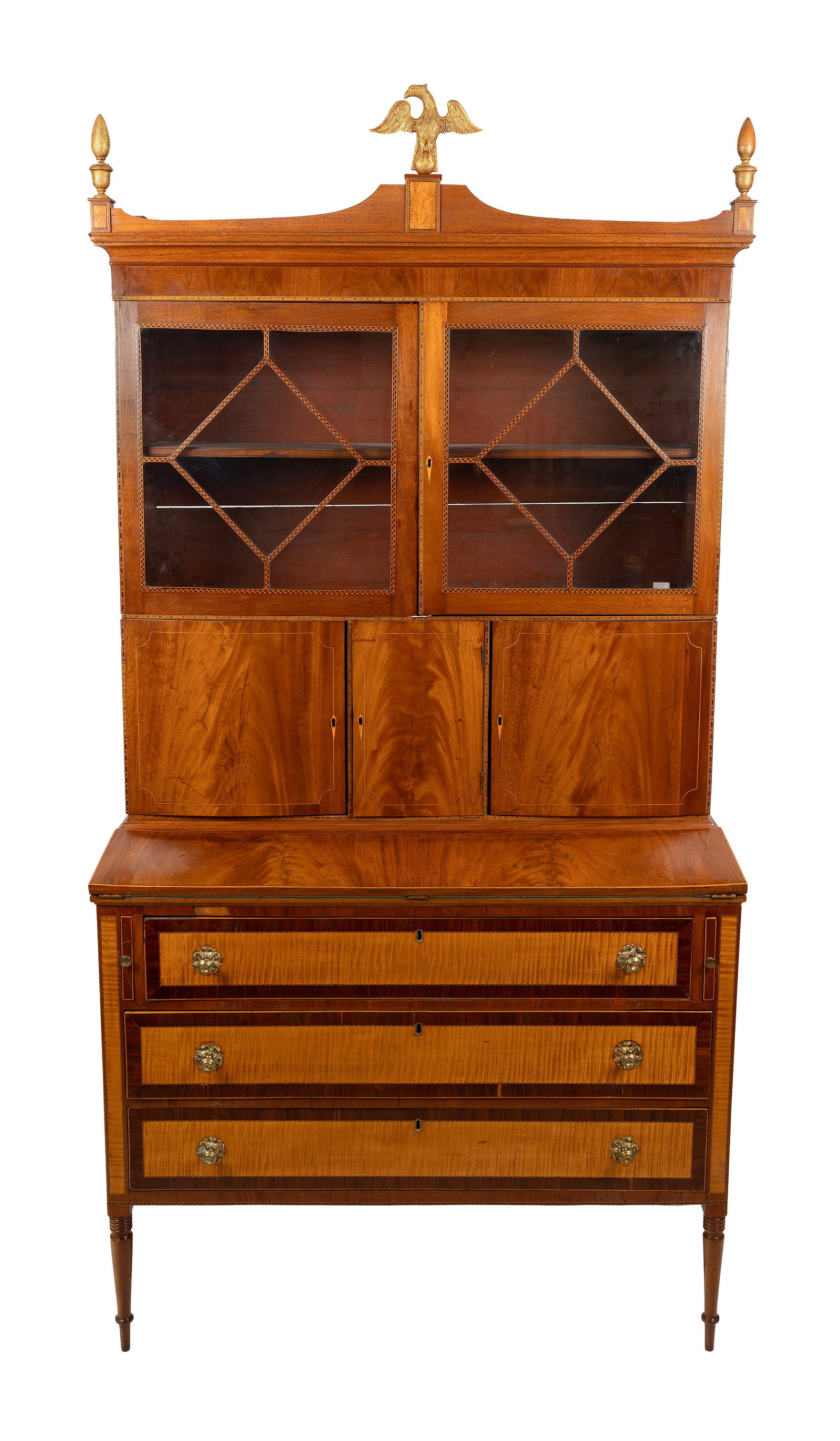 SHERATON MAHOGANY AND MAHOGANY VENEER TWO-PART SECRETARY North Shore of Massachusetts, Circa 1805: SHERATON MAHOGANY AND MAHOGANY VENEER TWO-PART SECRETARY North Shore of Massachusetts, Circa 1805 Veneered cornice supports a gilt eagle finial at center and urn finials at the corners. Upper case wit