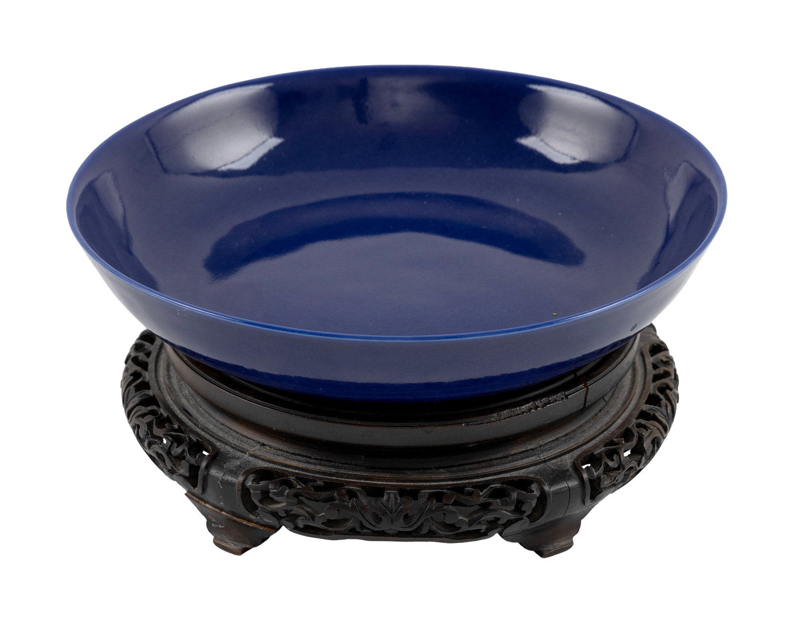 CHINESE COBALT BLUE PORCELAIN DISH Guangxu Period, 1875-1908 Height 2". Diameter 8". With carved: CHINESE COBALT BLUE PORCELAIN DISH Guangxu Period, 1875-1908 Six-character Guangxu mark on base. Height 2". Diameter 8". With carved wooden stand. Provenance: The Estate of Dr. William E. Strole, Jr. 