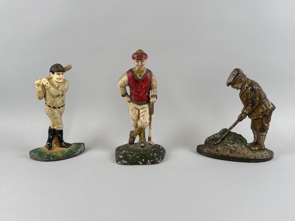 THREE CAST IRON SPORTS FIGURE DOORSTOPS 20th Century Heights 8", 9" and 10". (1 of 2)