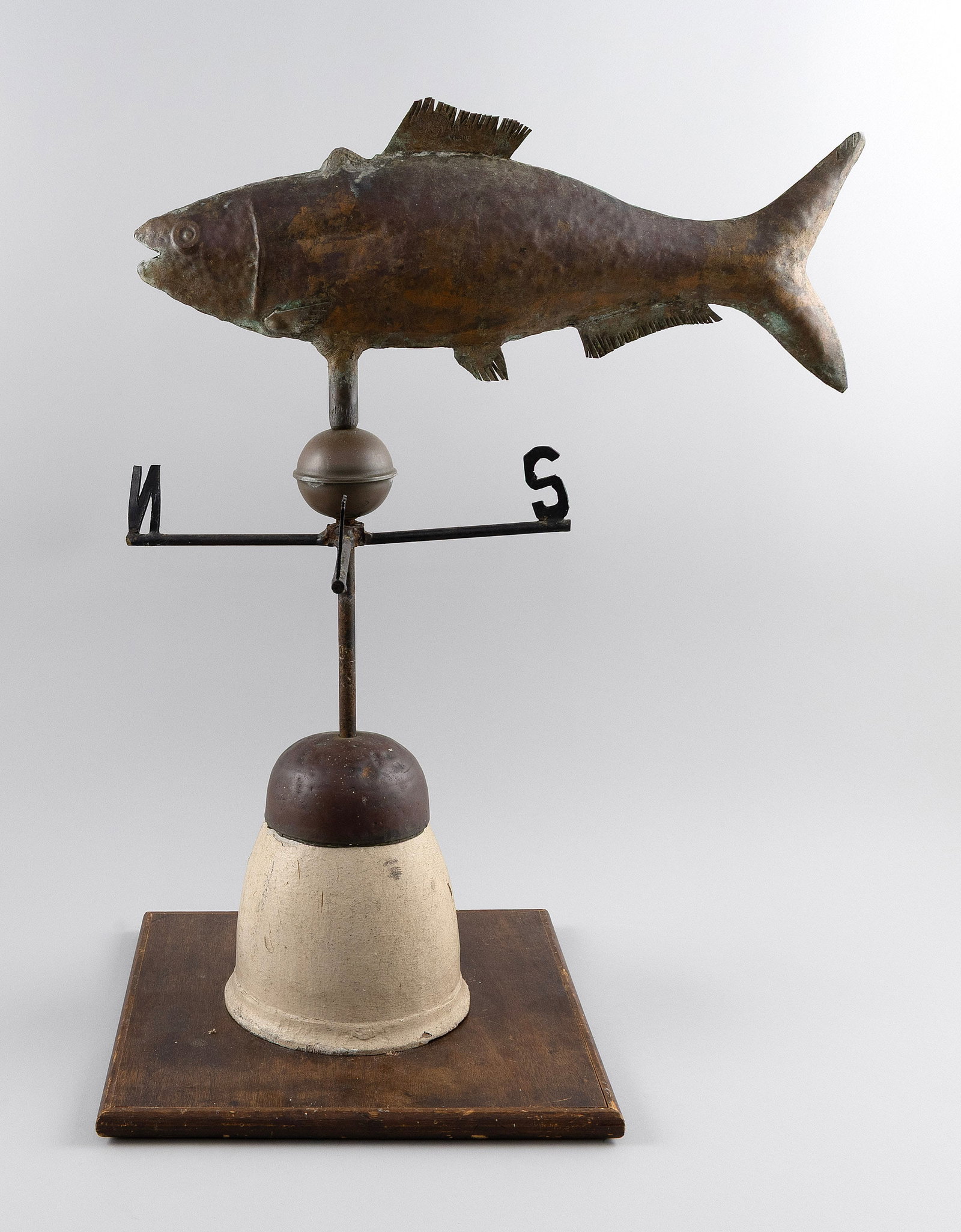 COPPER CODFISH WEATHER VANE Wilmington, Delaware, 20th Century Height 27.5". Length 20".: COPPER CODFISH WEATHER VANE Wilmington, Delaware, 20th Century Signed "F. Holzman Wm Del". Mounted with directionals on a wood and copper base. Height 27.5". Length 20".